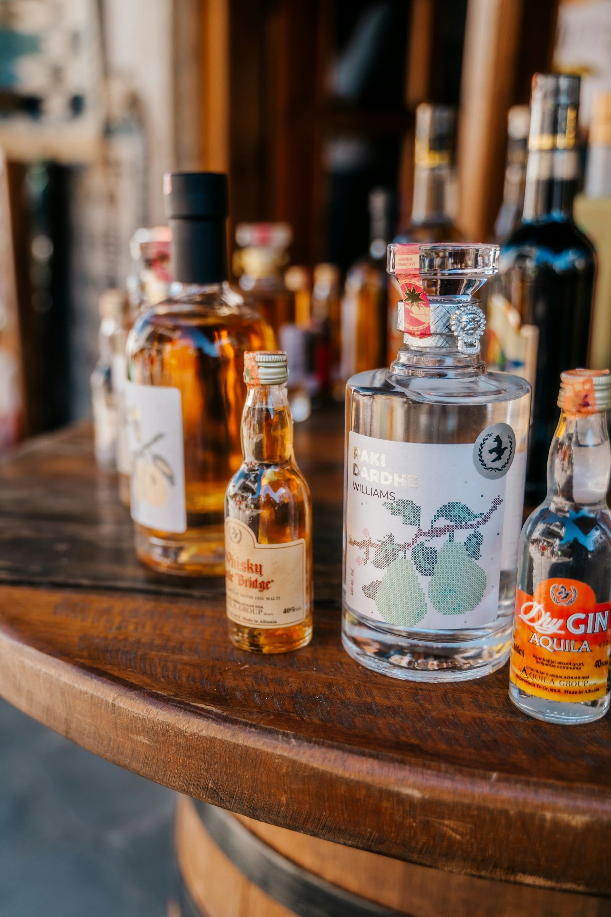 Bottles of spirits on a wooden table in Albania