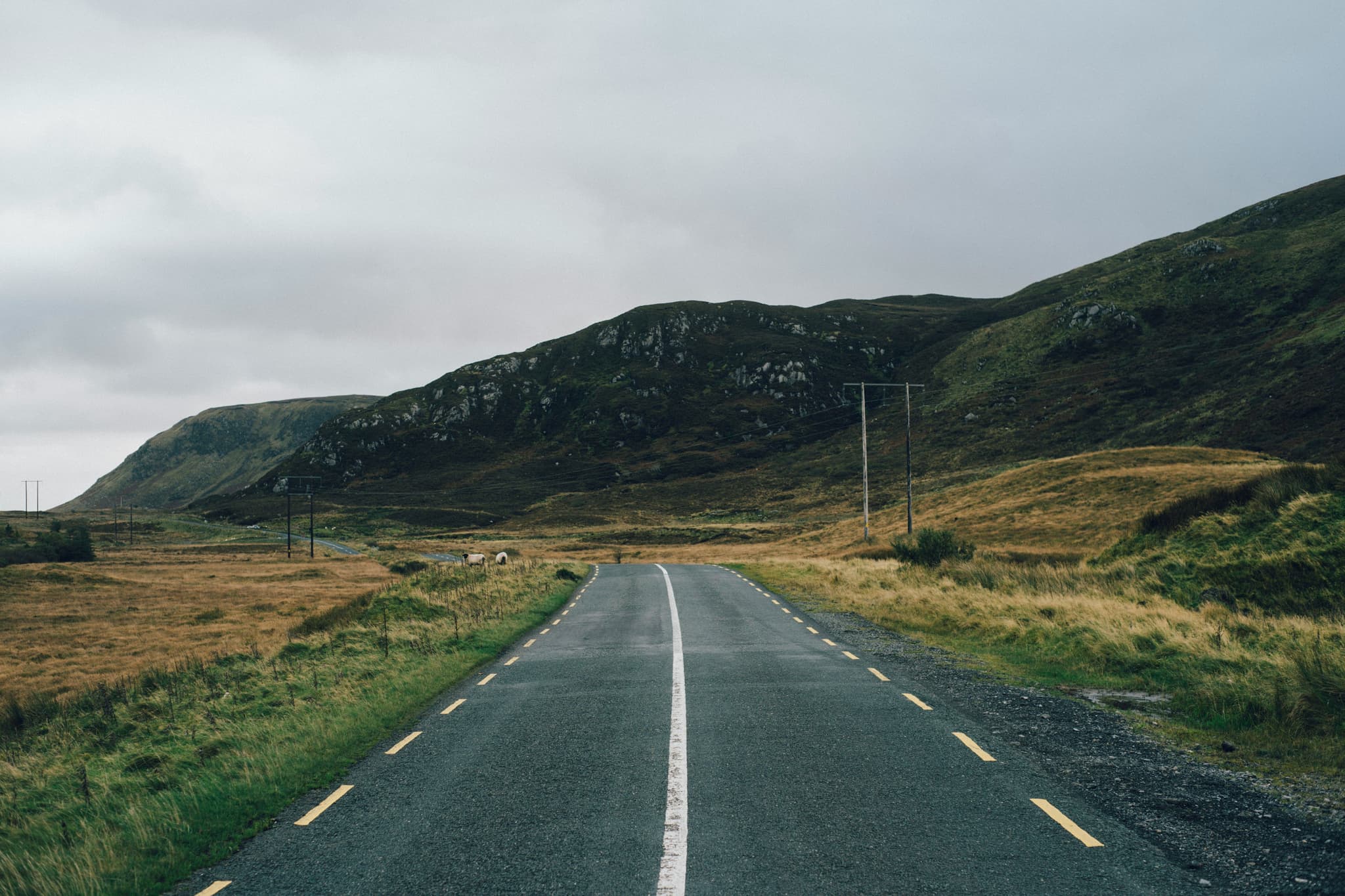 Road on the Wild Atlantic Way surrounded by high mountains
