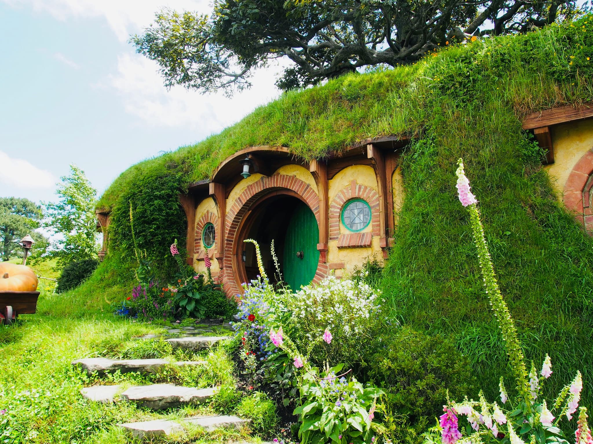 Hobbit holes and gardens at the Hobbiton movie set near Matamata, New Zealand