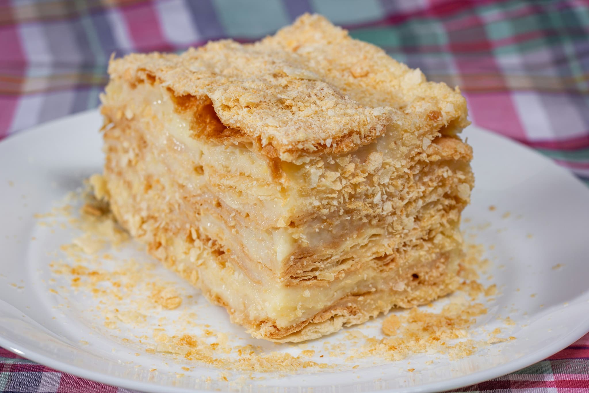 Closeup of a pastry filled with vanilla cream called Kremna Rezina
