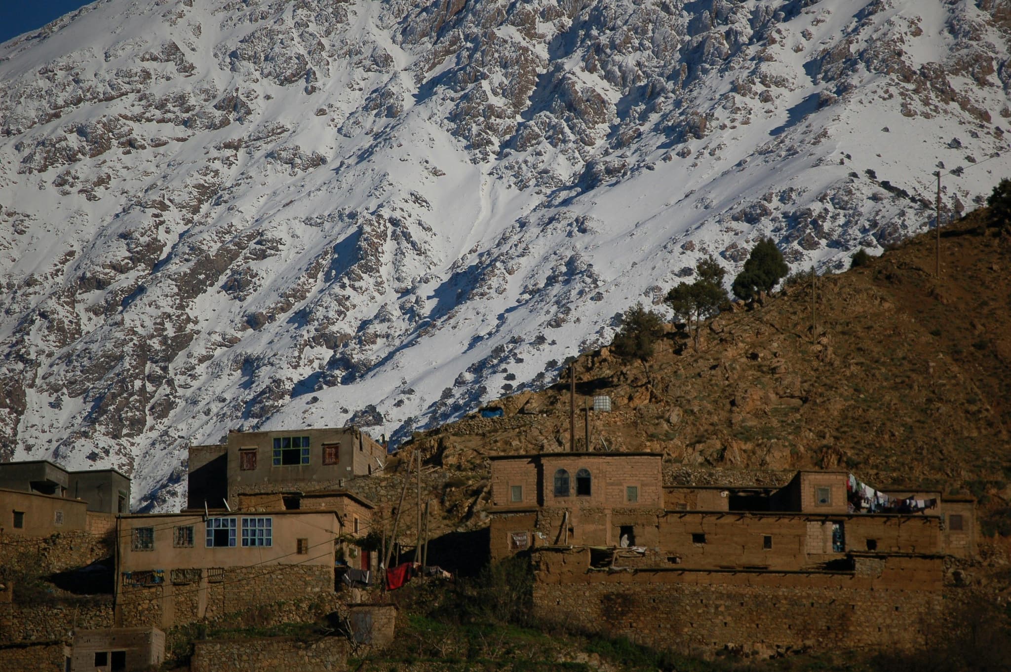 Atlas mountains with snow and brick houses