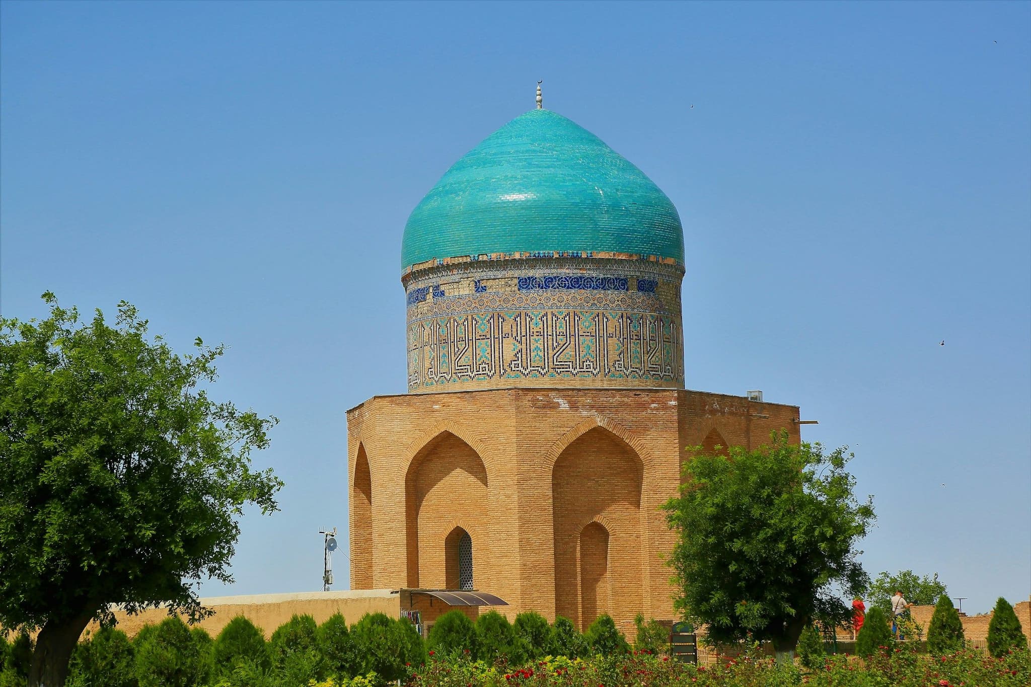 A ribbed turquoise dome on a medieval brick mausoleum in Turkistan