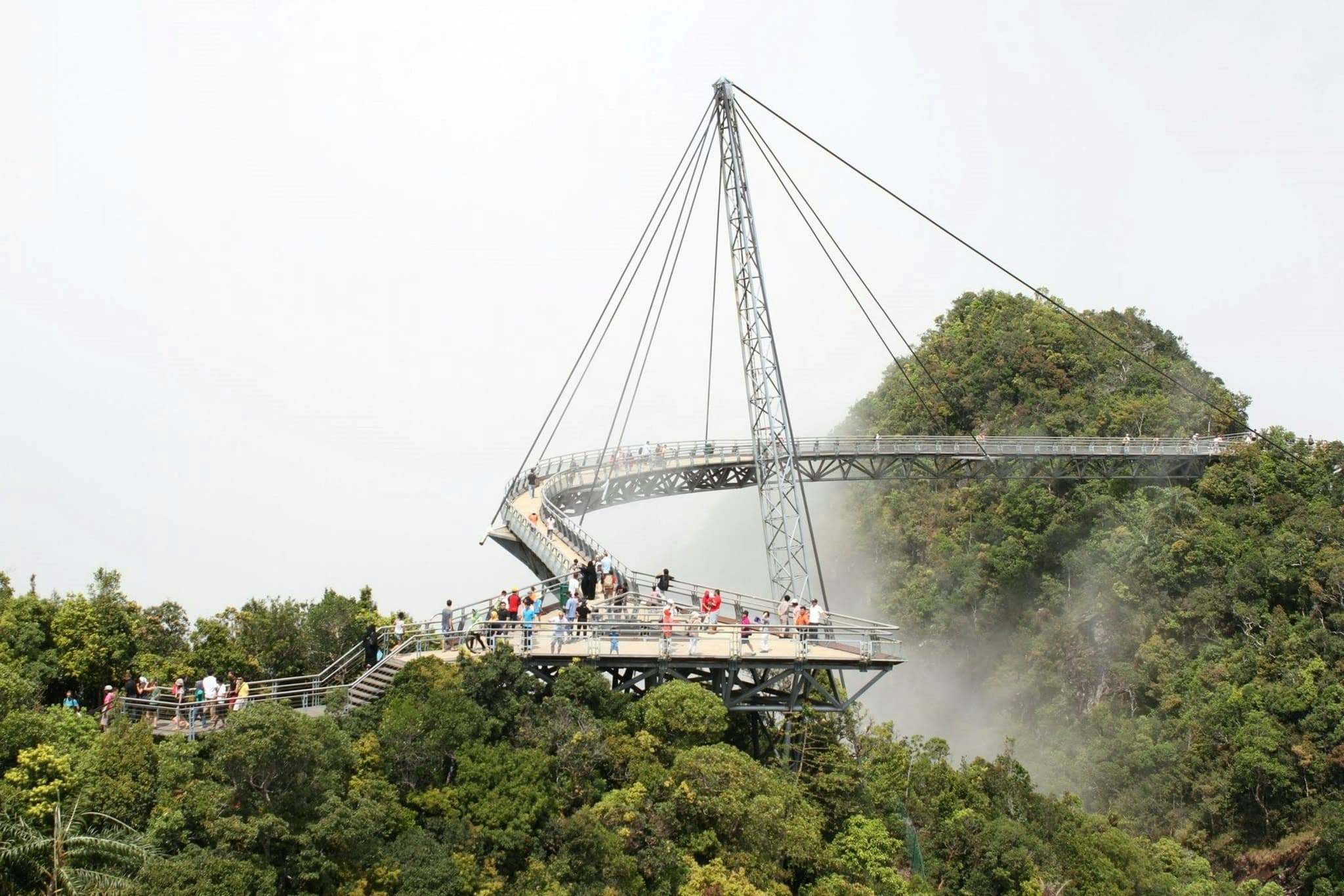 The curved Langkawi Sky Bridge above the rainforest and mountain mist