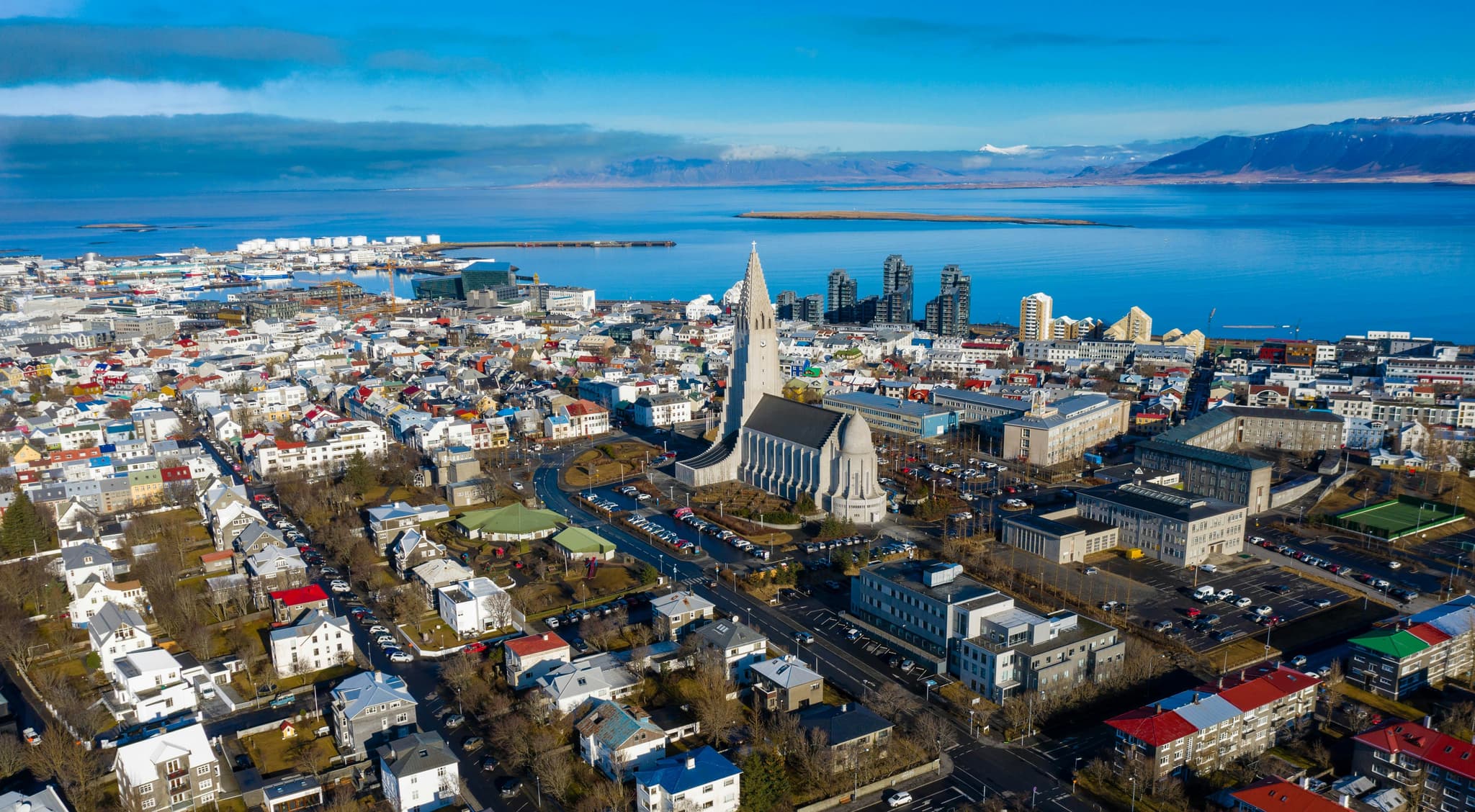 The city and buildings of Reykjavik from above next to the sea
