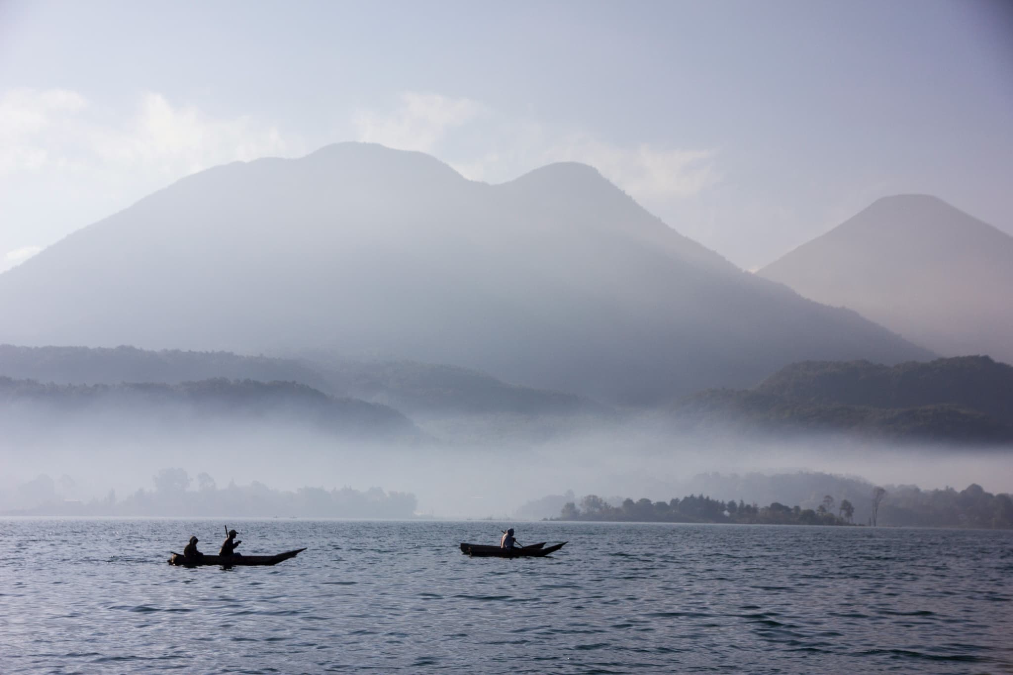 Misty lake in Guatemala with mountains in background