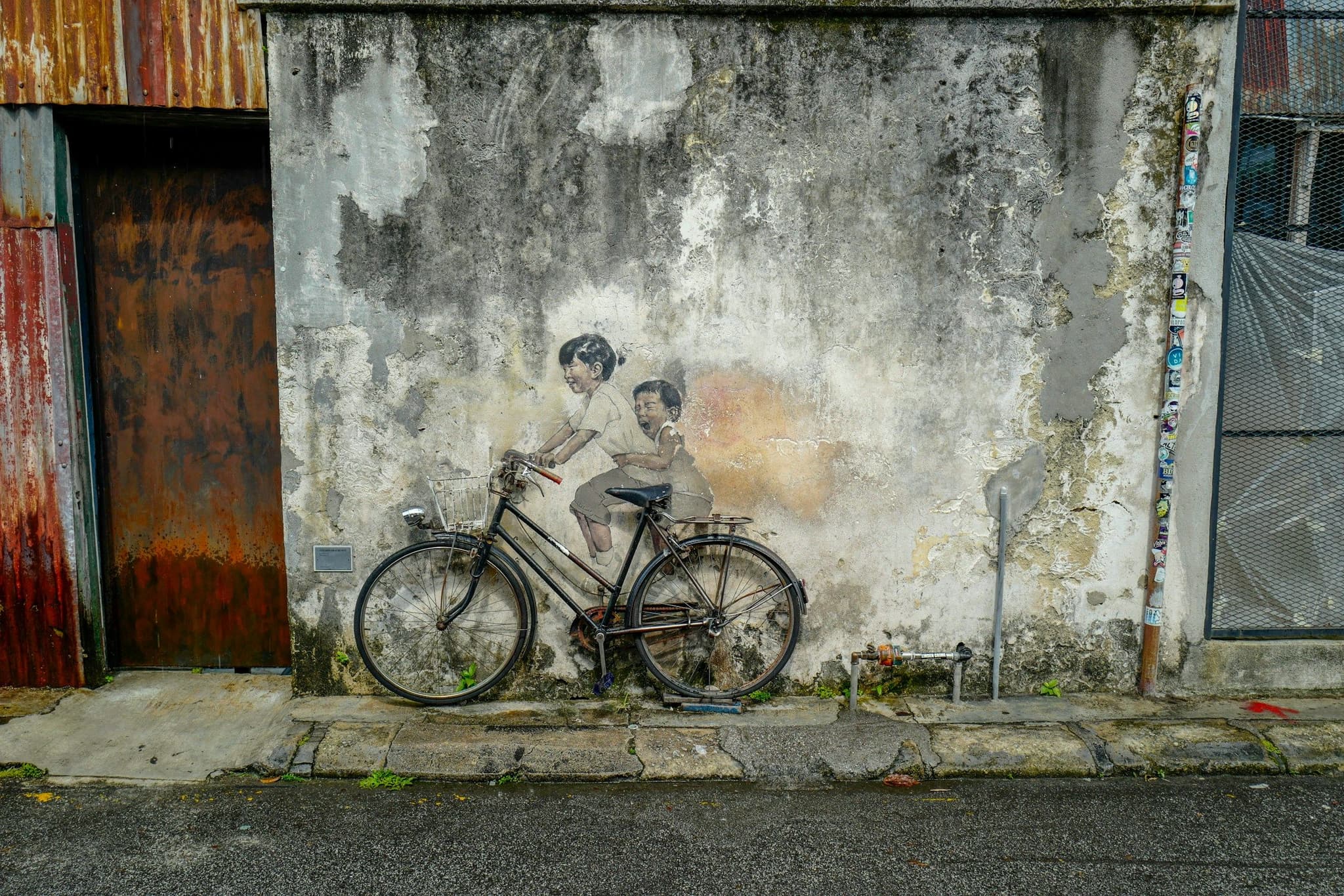 A street art mural on a shophouse wall in George Town, Penang