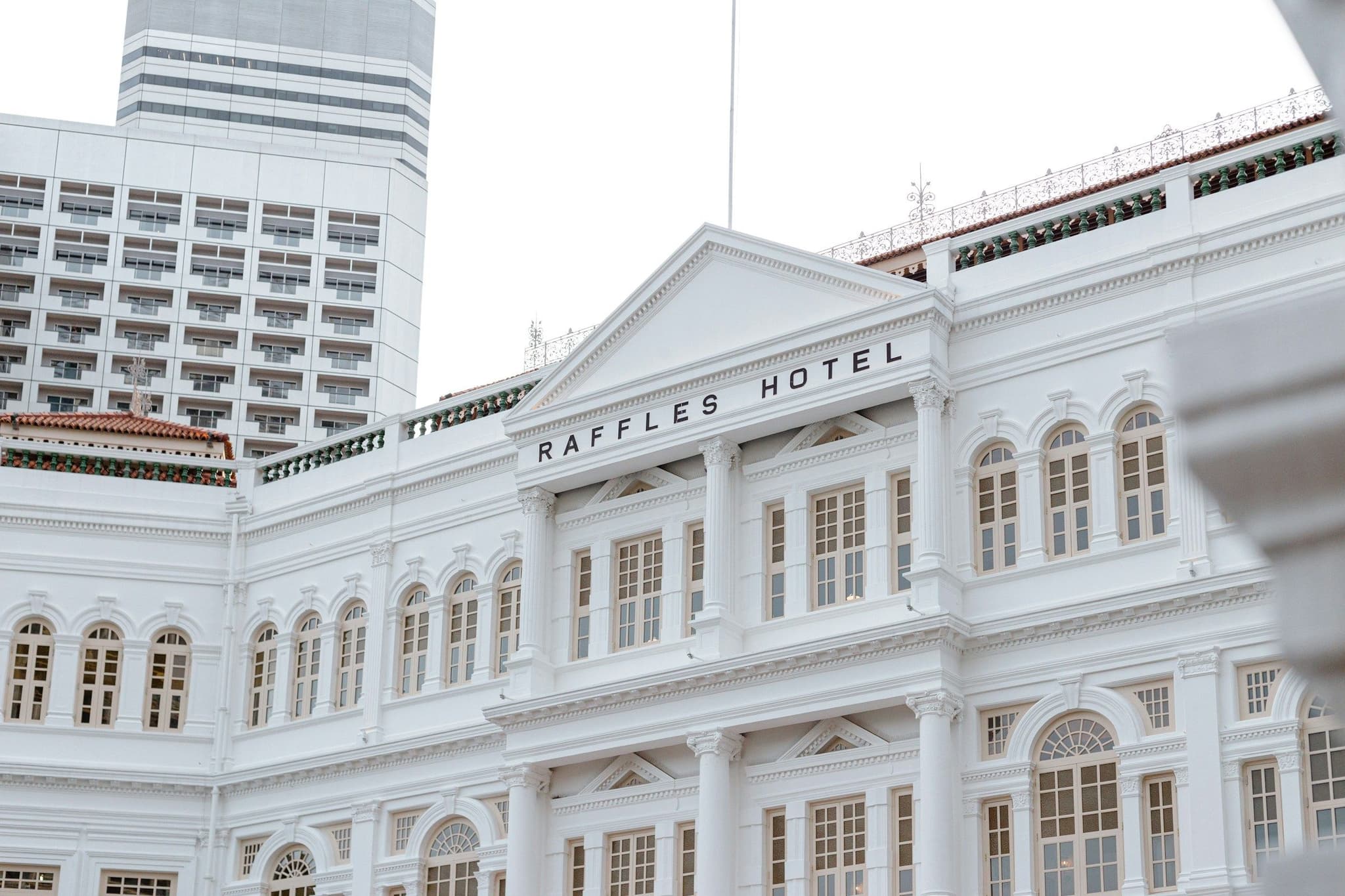The white colonial facade of Raffles Hotel in Singapore
