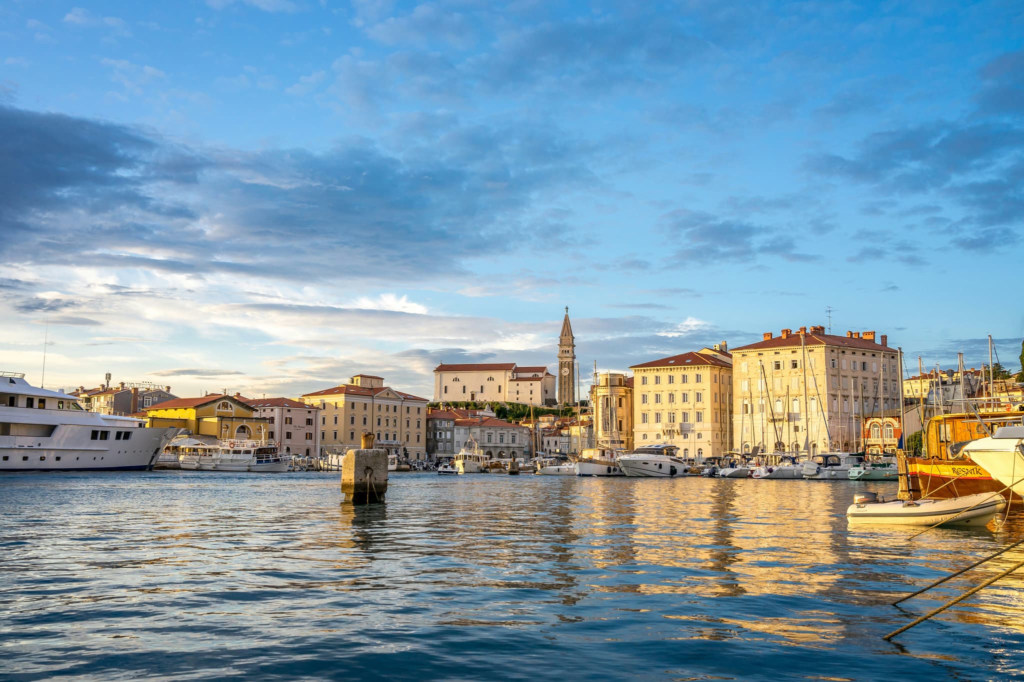 A picture of the water harbour in Piran showing Venice influences