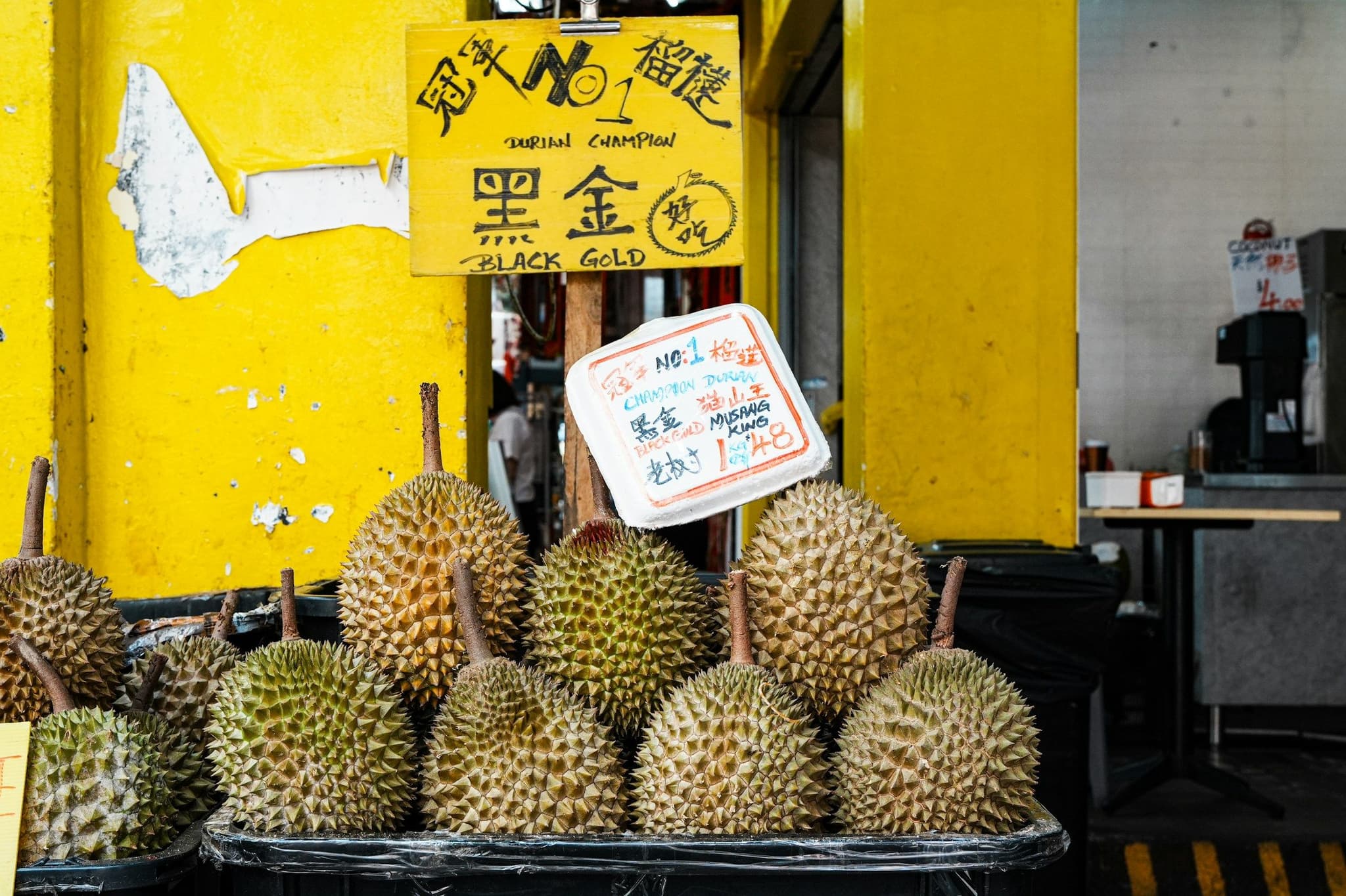 Fresh durians for sale at a market stall