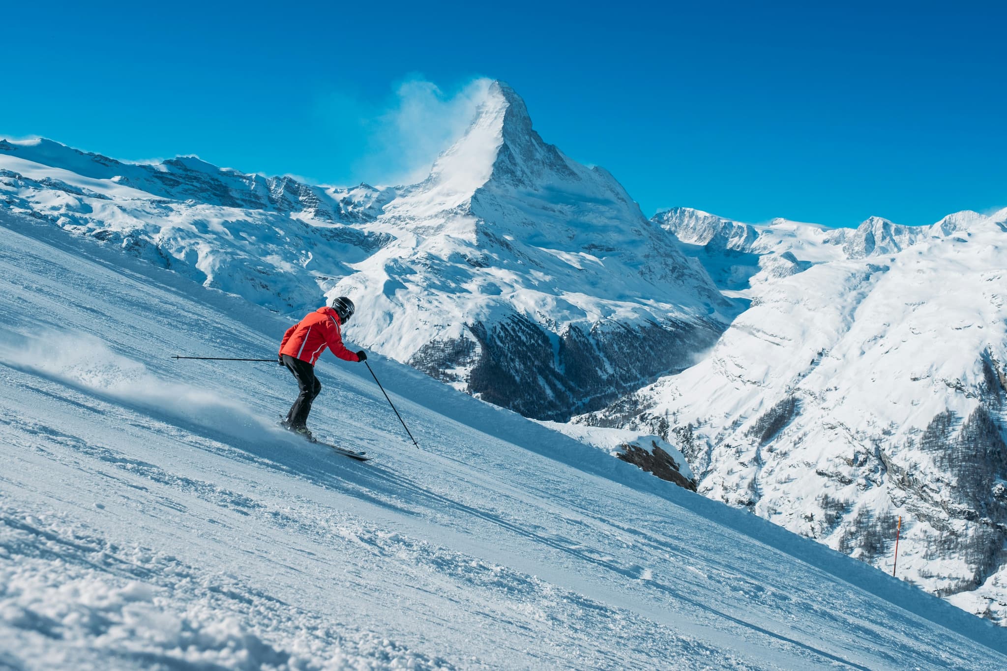 Skier on a slope with the Matterhorn in the background near Zermatt