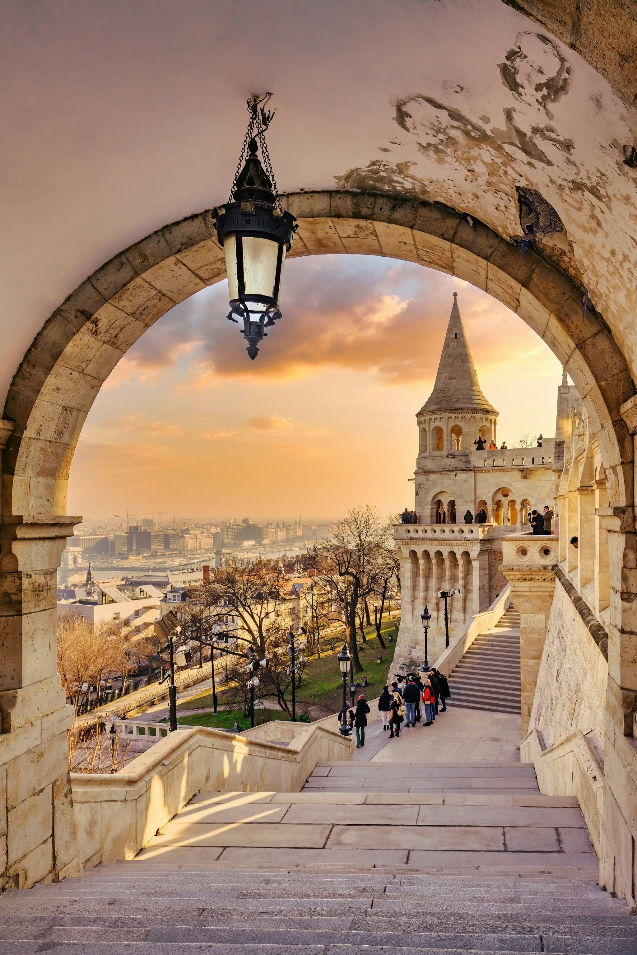 A stone walkway and arch at Fisherman's Bastion looking out over Budapest