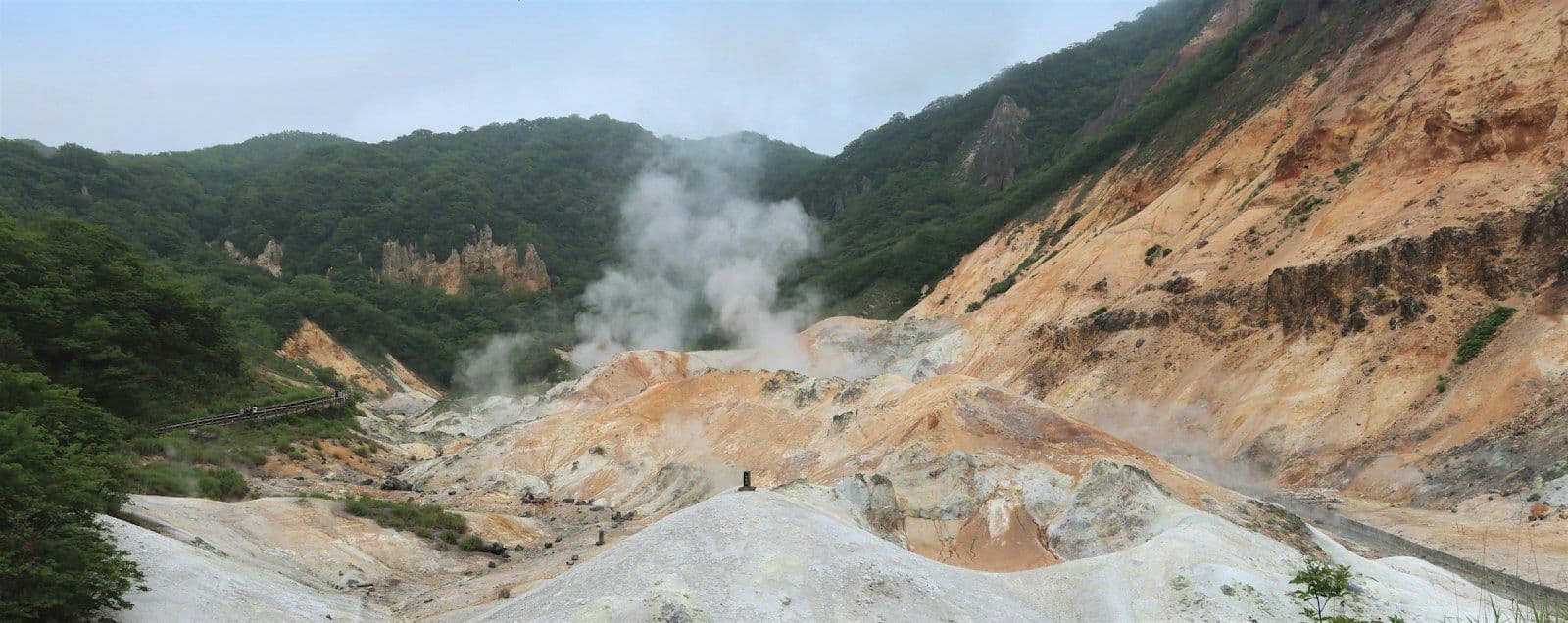 The volcanic rock formations of Jigokudani (Hell Valley) in Noboribetsu, Hokkaido, Japan, the steaming valley that gives the onsen town its name.