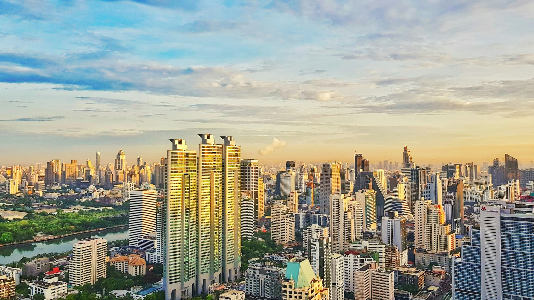 Bangkok skyline with tall buildings during an early sunset