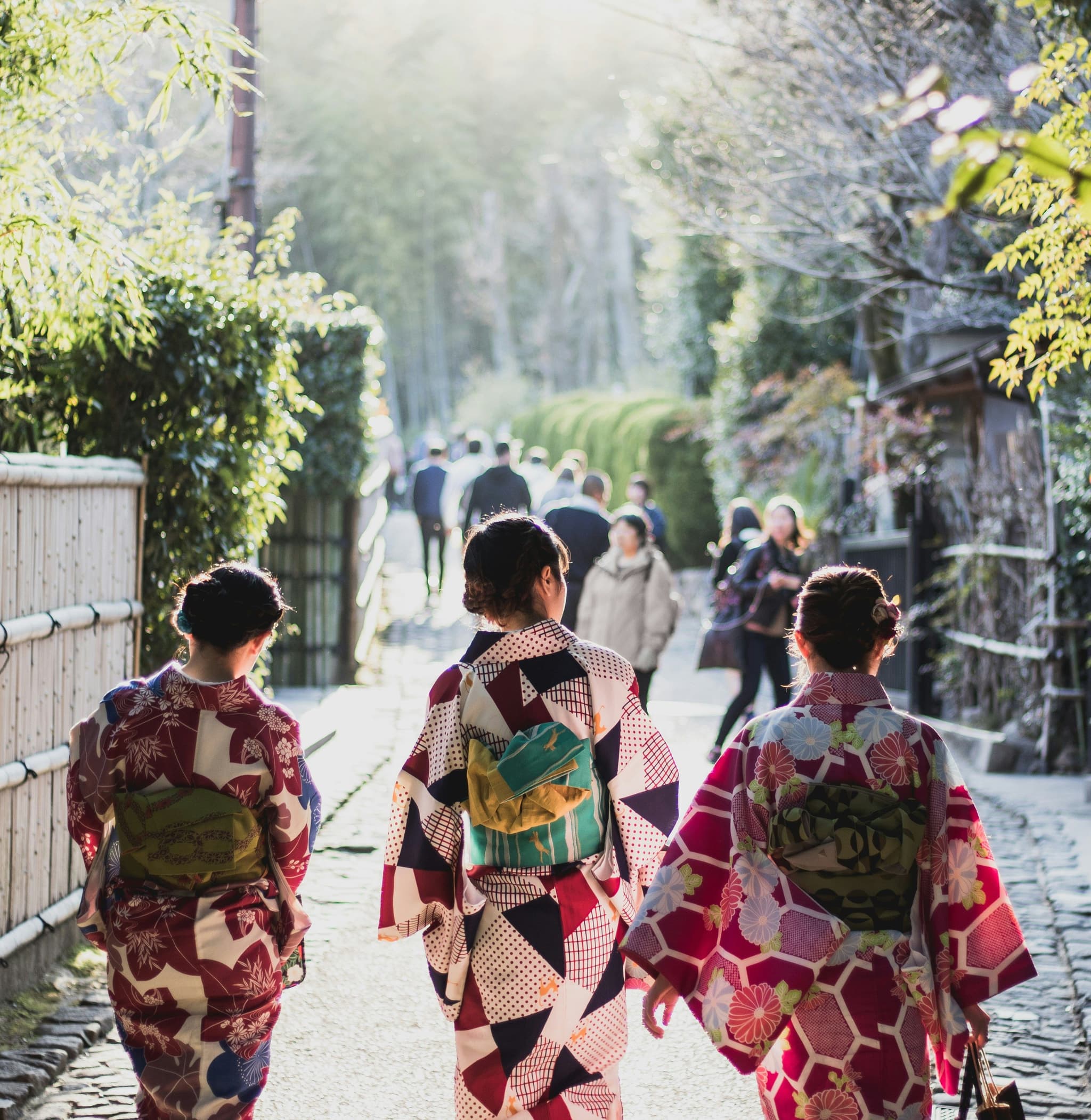 Three woman walking and wearing yukata