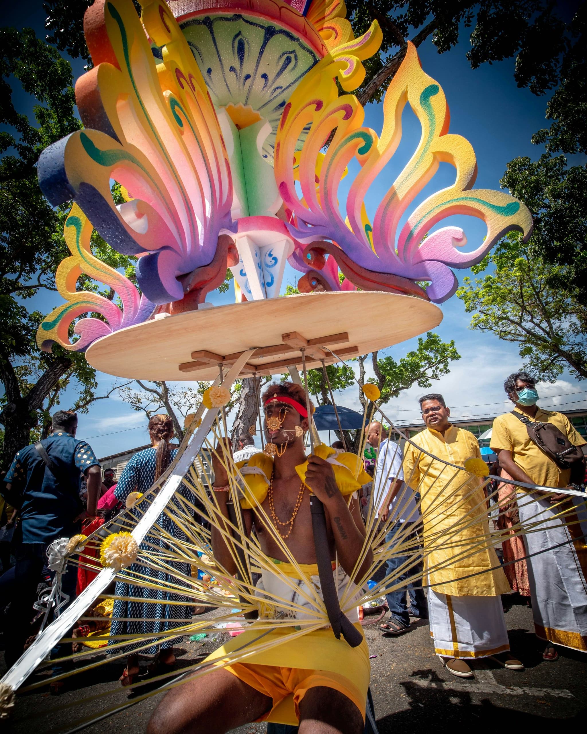 A devotee carrying a decorated kavadi during Thaipusam