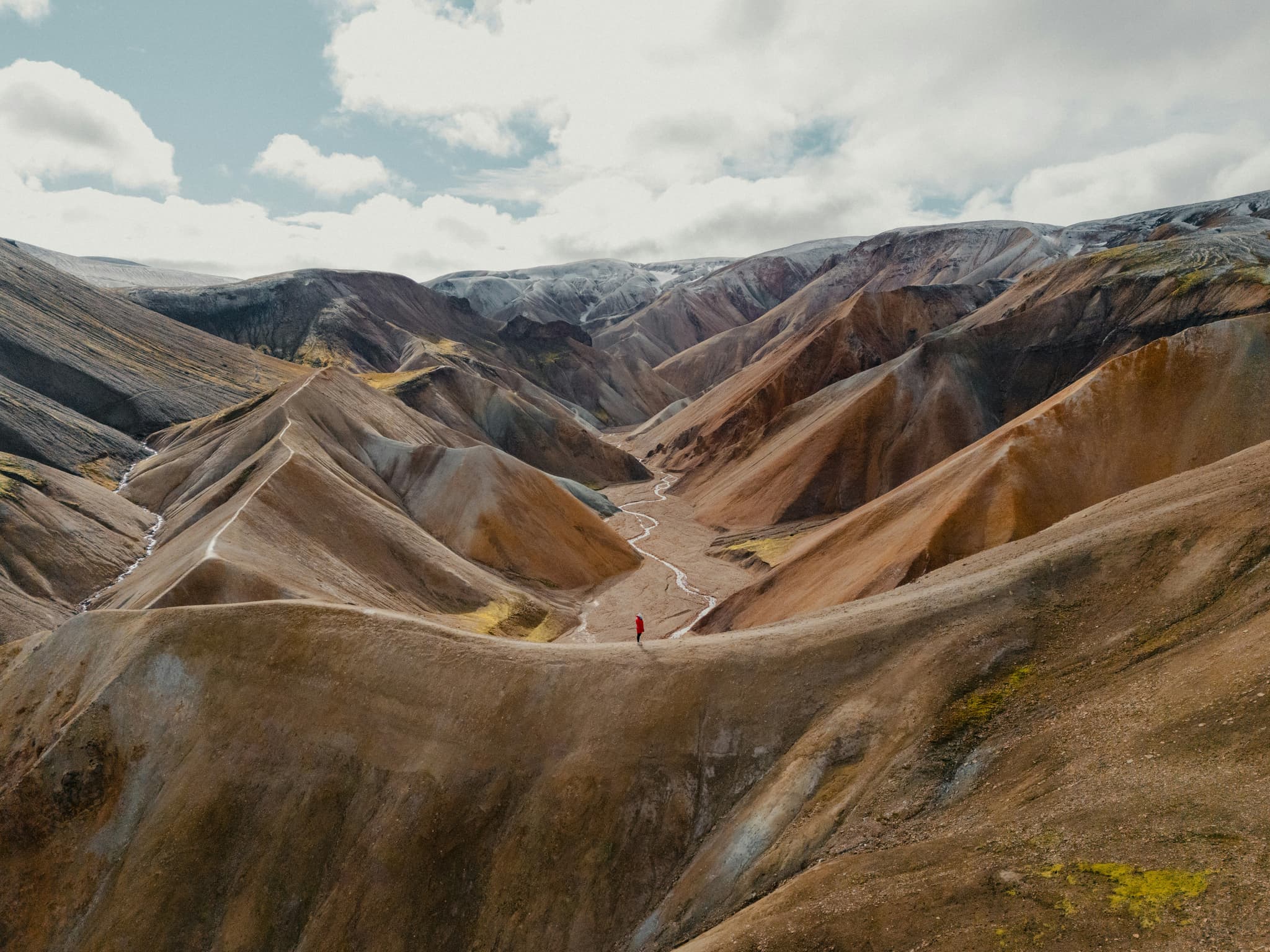 the curvy and steep rocky mountains of Landmannalaugar and Laugavegur trail visible from above