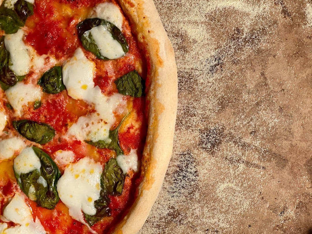 A homemade pizza Margherita with buffalo mozzarella and basil
