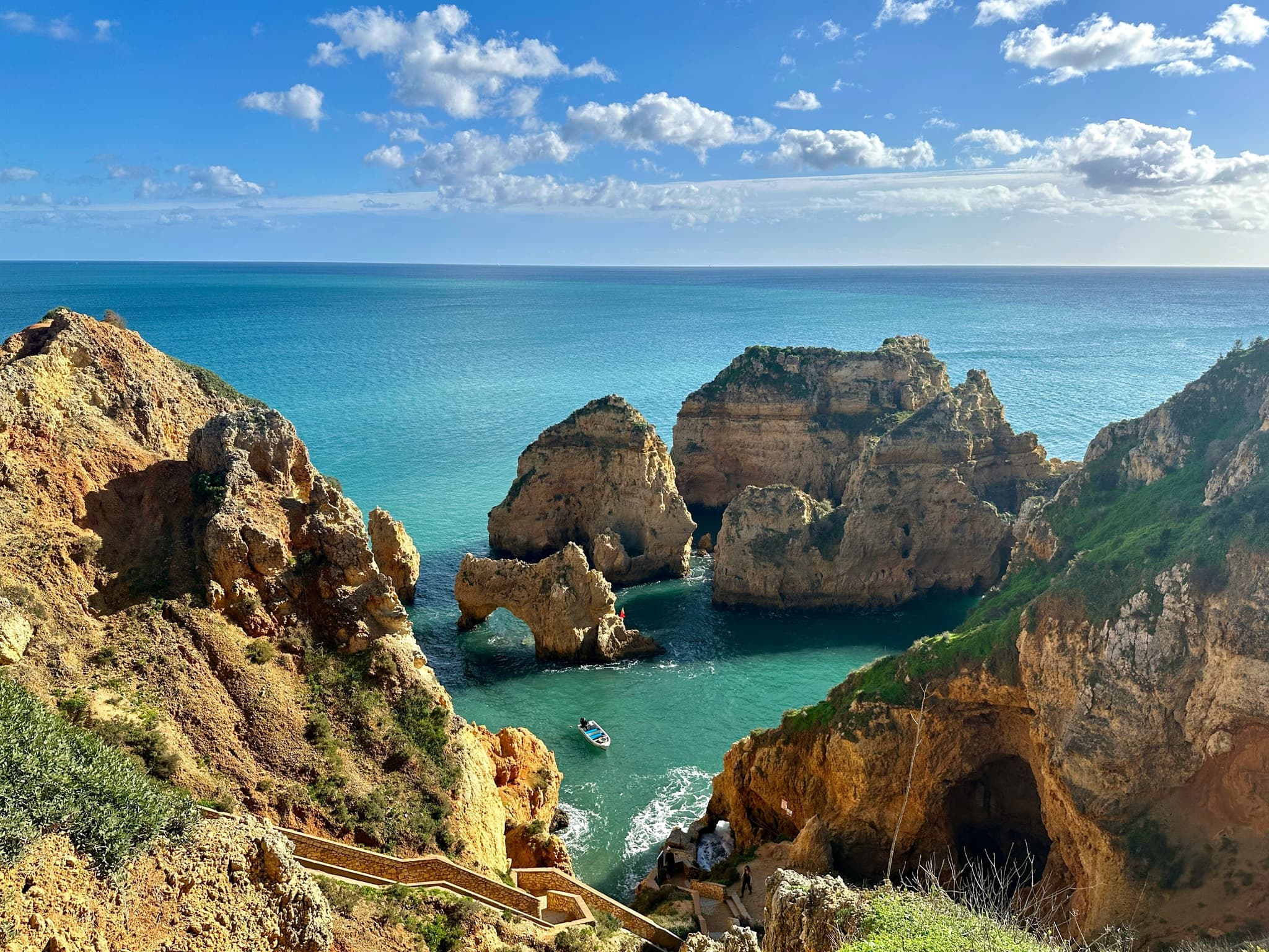 Cliffs and turqoise water from a viewpoint in lagos portugal