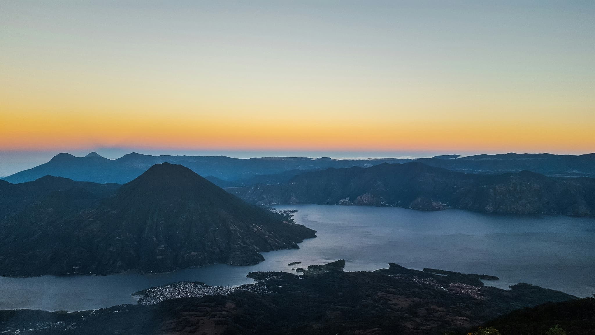 lake Atitlán with mountains at sunset