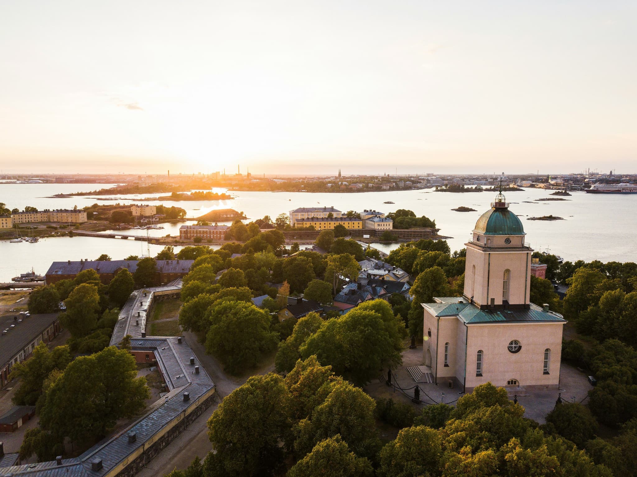 Helsinki from above, the church is visible, green trees and the waterfront