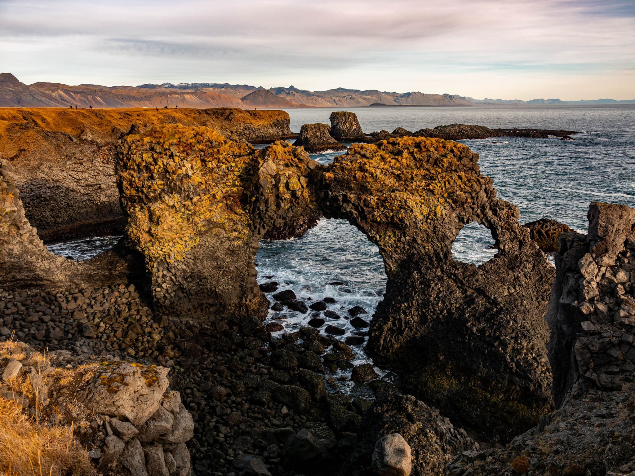 Coastal rocks in arch shape in Arnarstapi Iceland