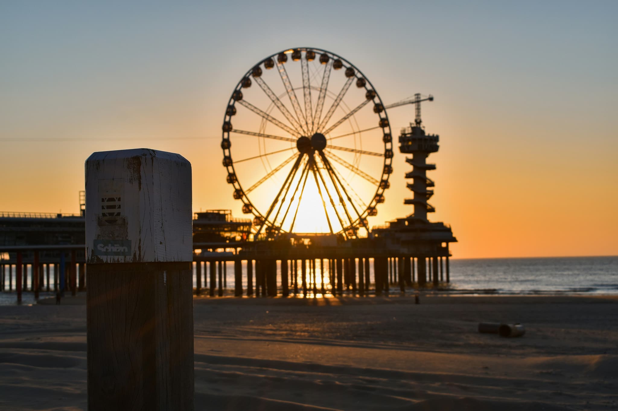 Ferris wheel at the scheveningen beach during sunset