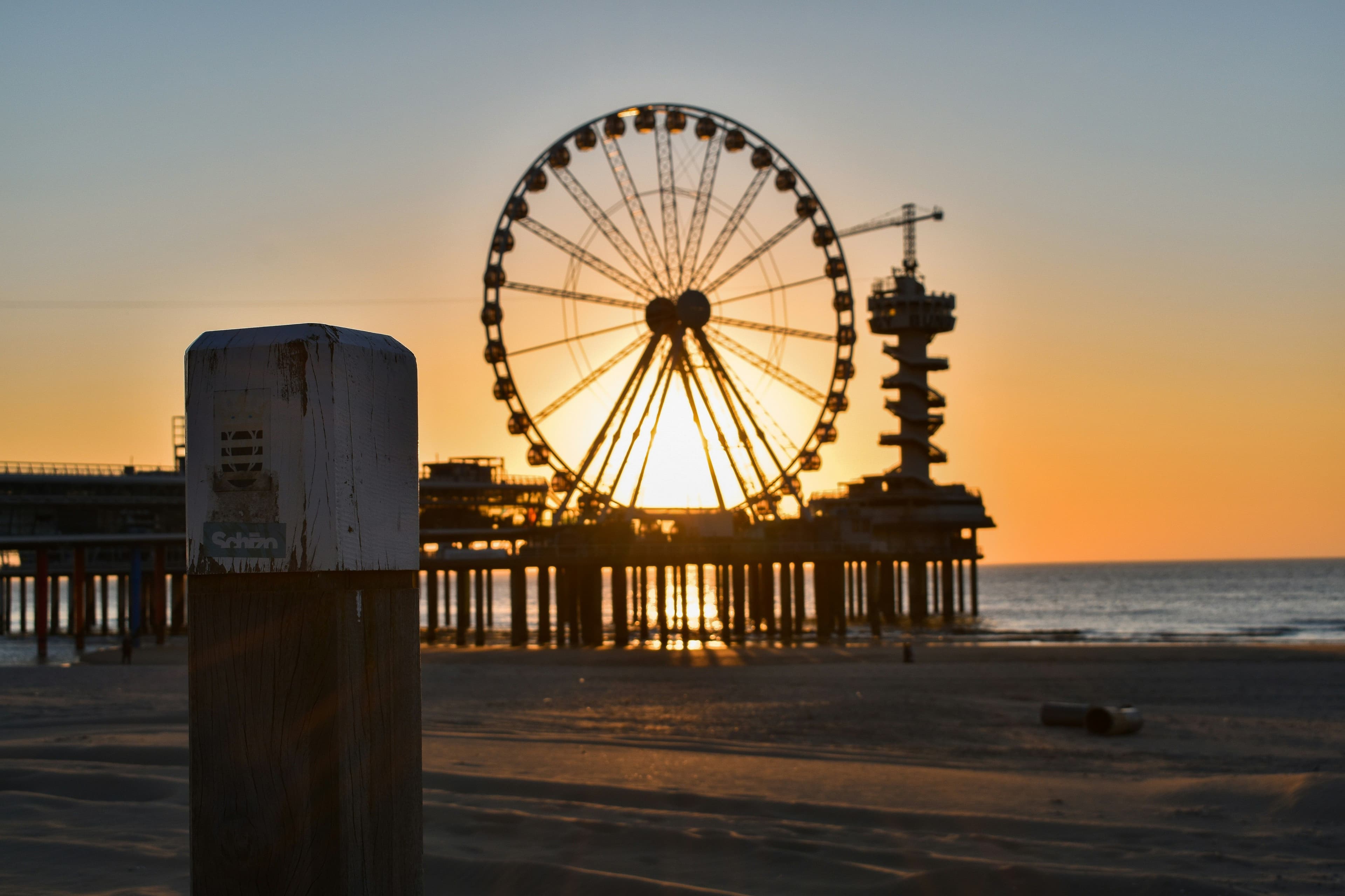 Ferris wheel at the scheveningen beach during sunset