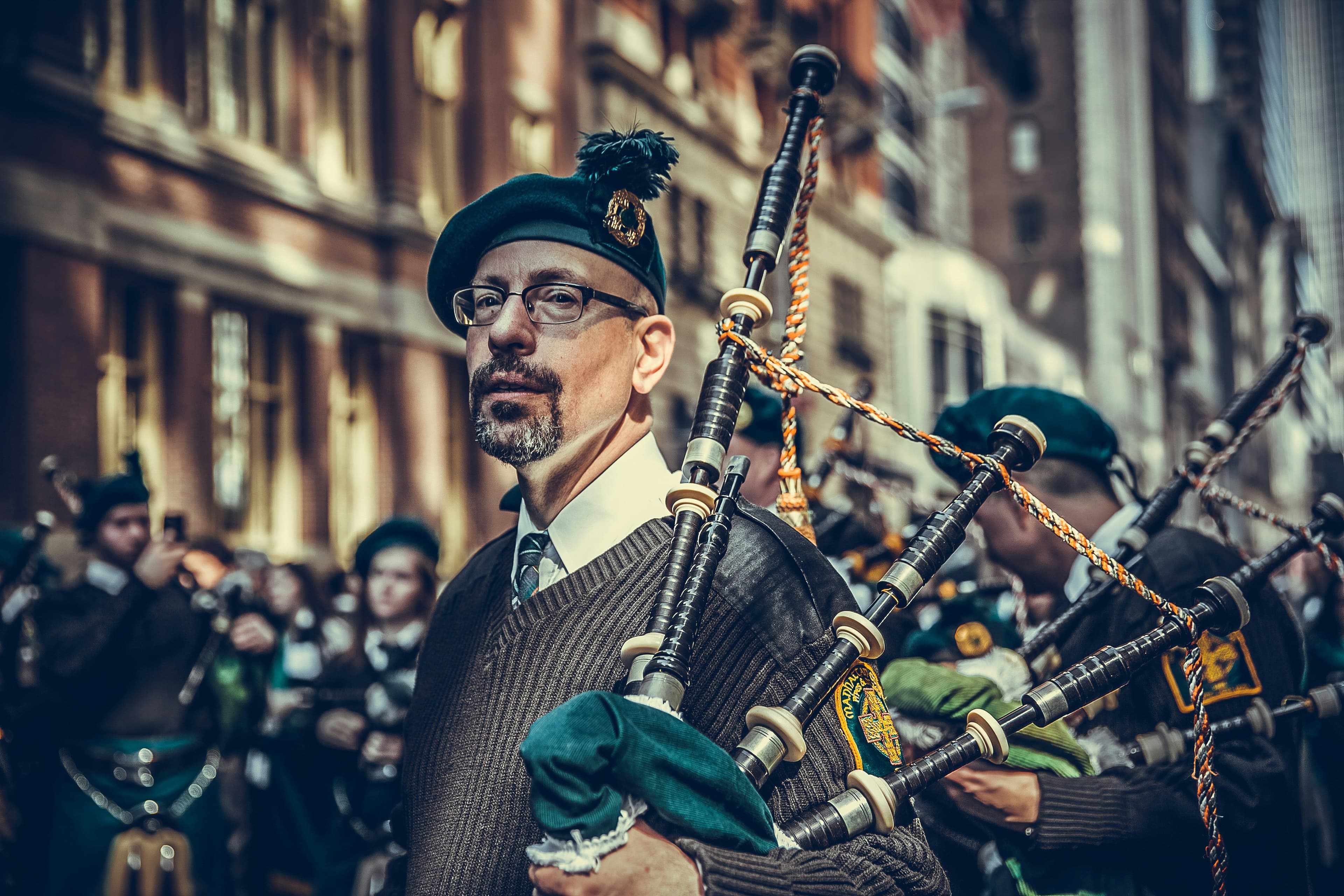 Man holding musical instrument during Patrick’s Day