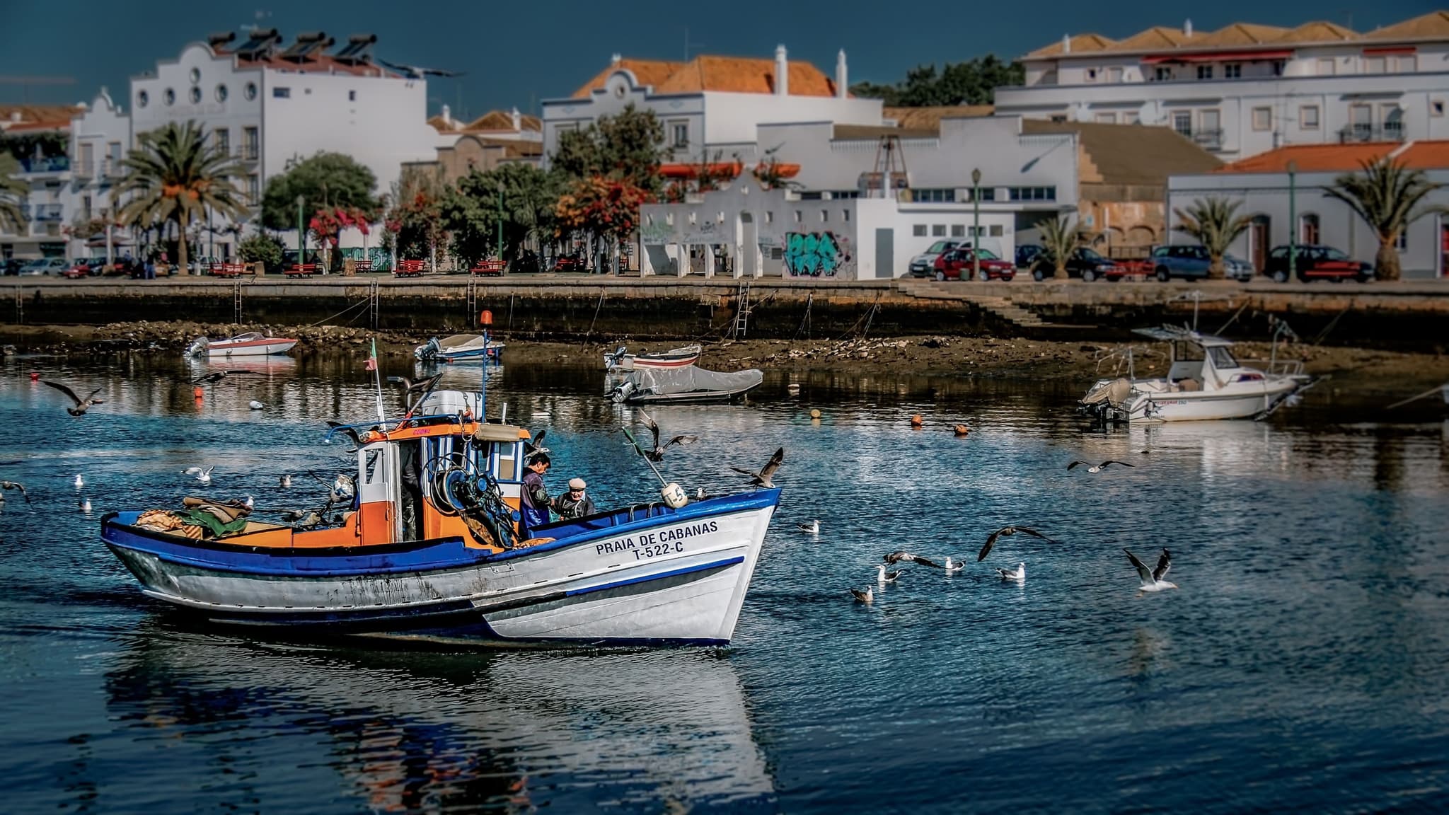 a fishers boat near the harbour on the water in tavira
