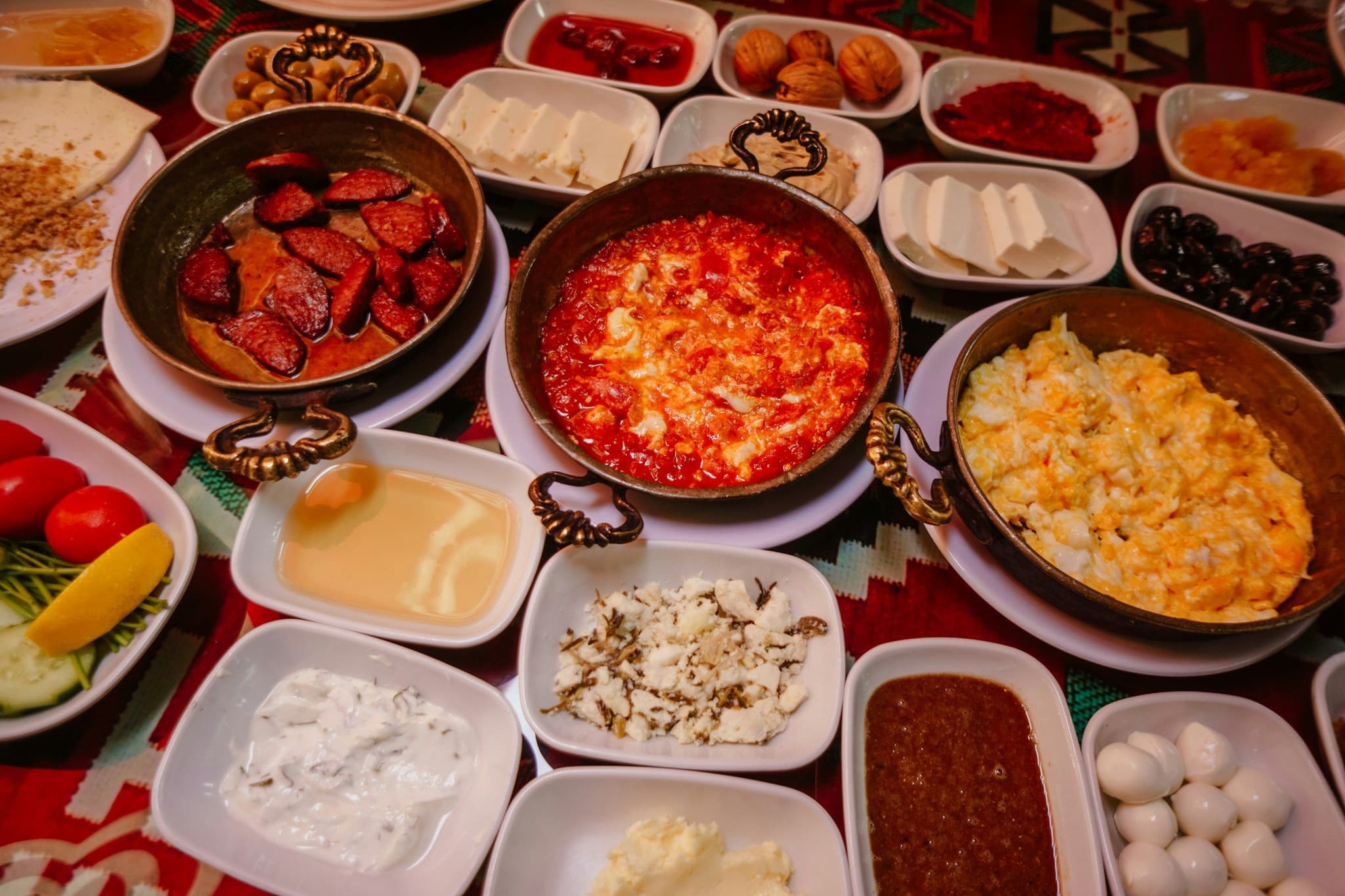 A Turkish breakfast spread with small dishes on the table