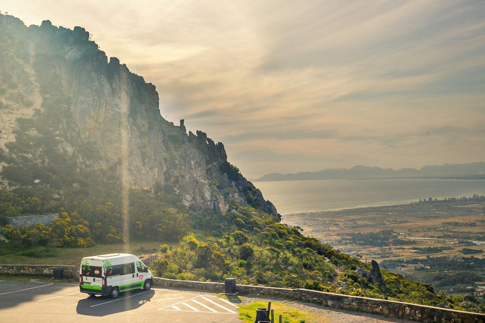 A coastal road winding along False Bay on South Africa's Western Cape coast