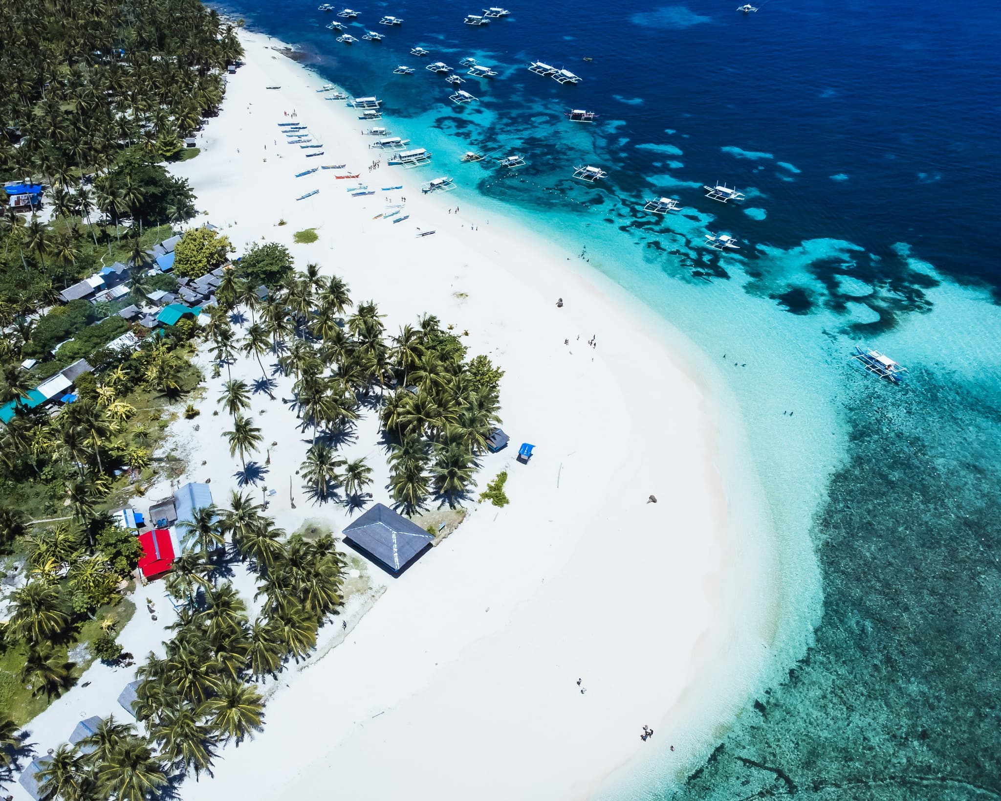 Siargao beach and turqoise water from above