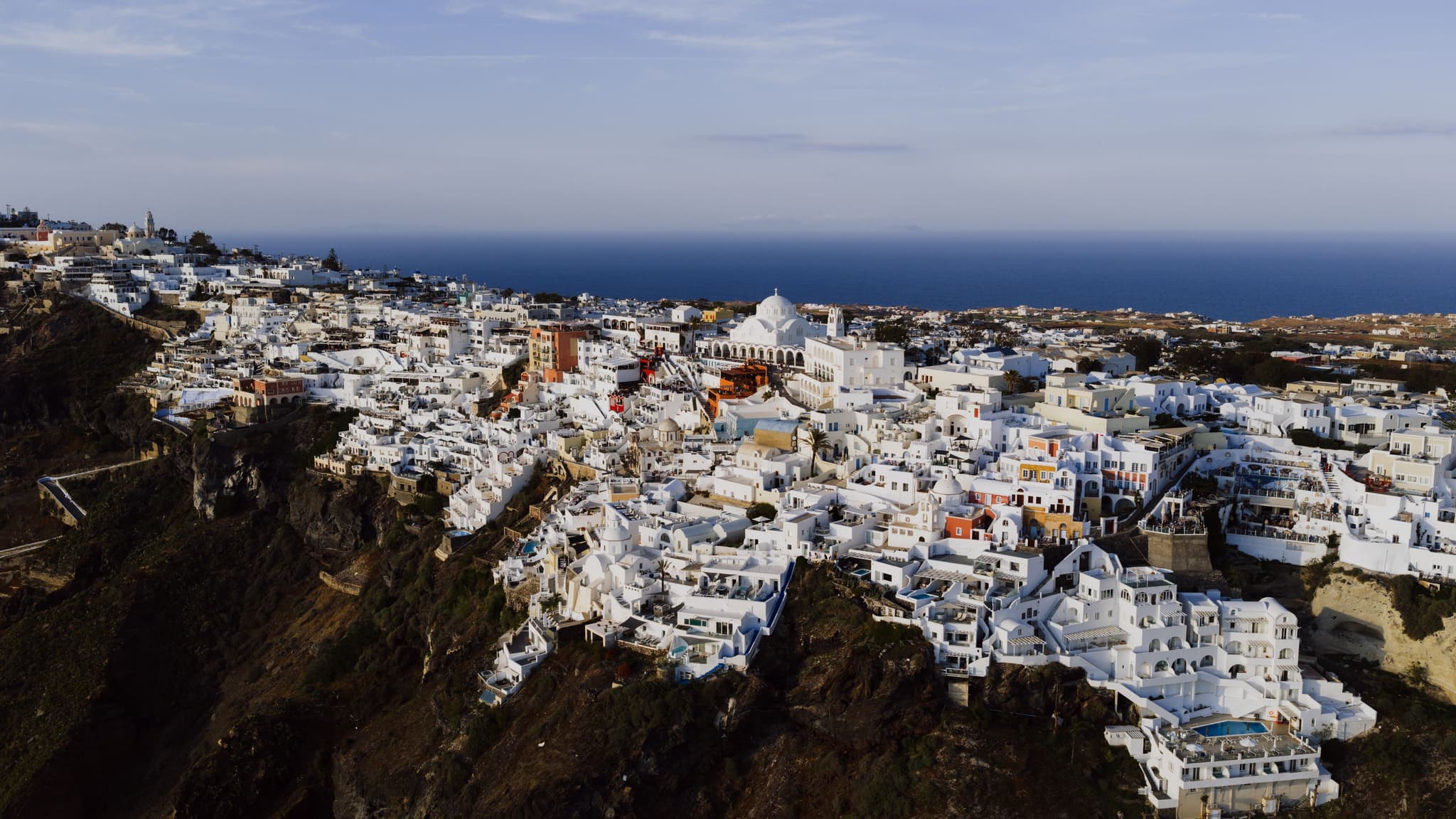 Aerial view of Fira's white architecture overlooking the Aegean Sea, Santorini, Greece
