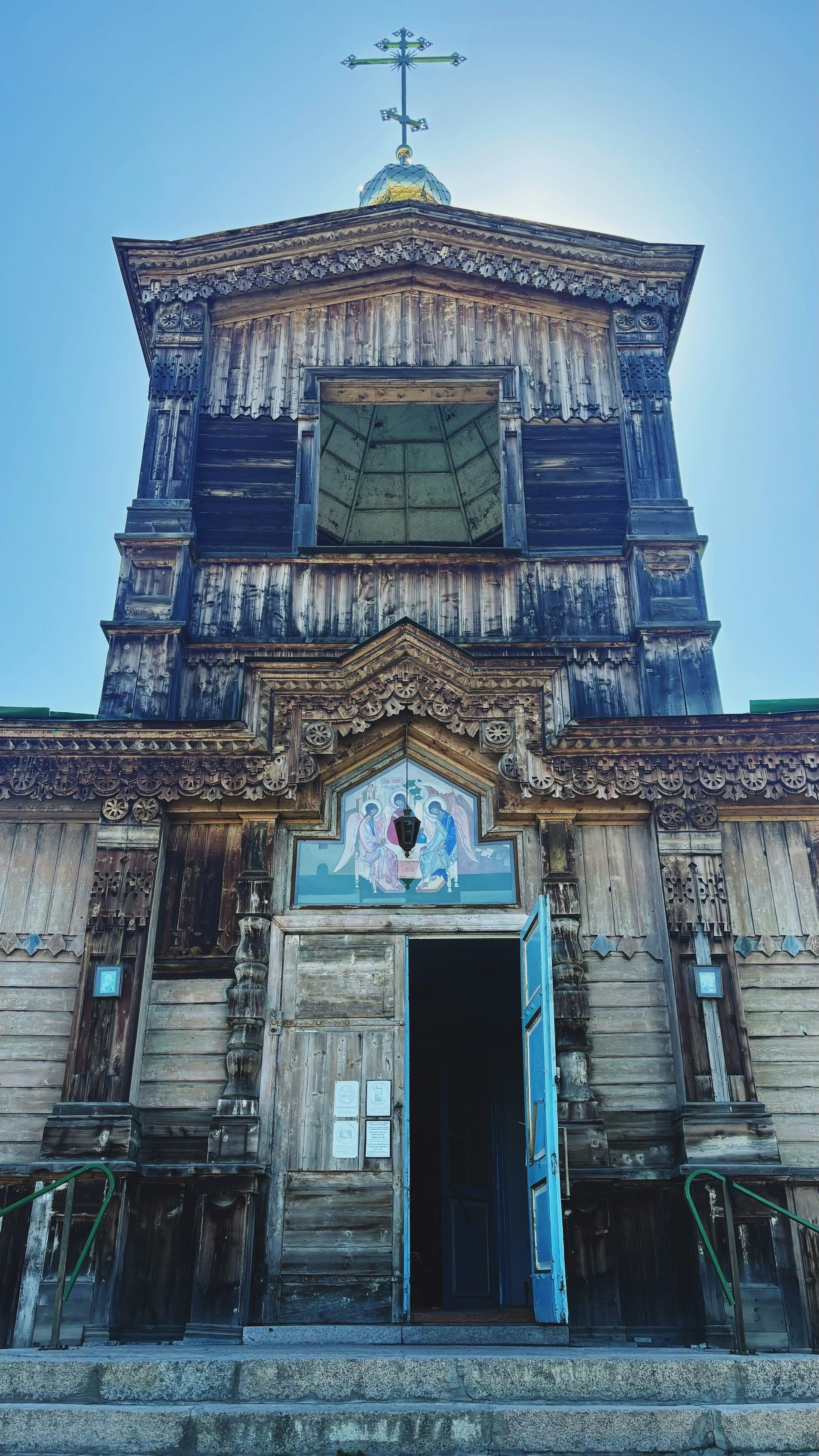 A church with a steeple and cross in Karakol