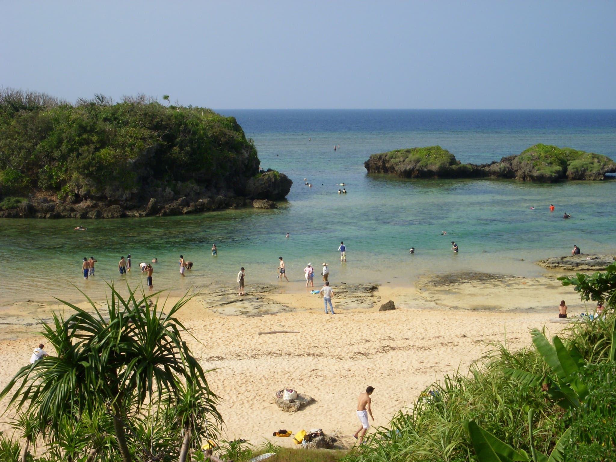 Iriomote island, Okinawa, beach with trees and people on the beach