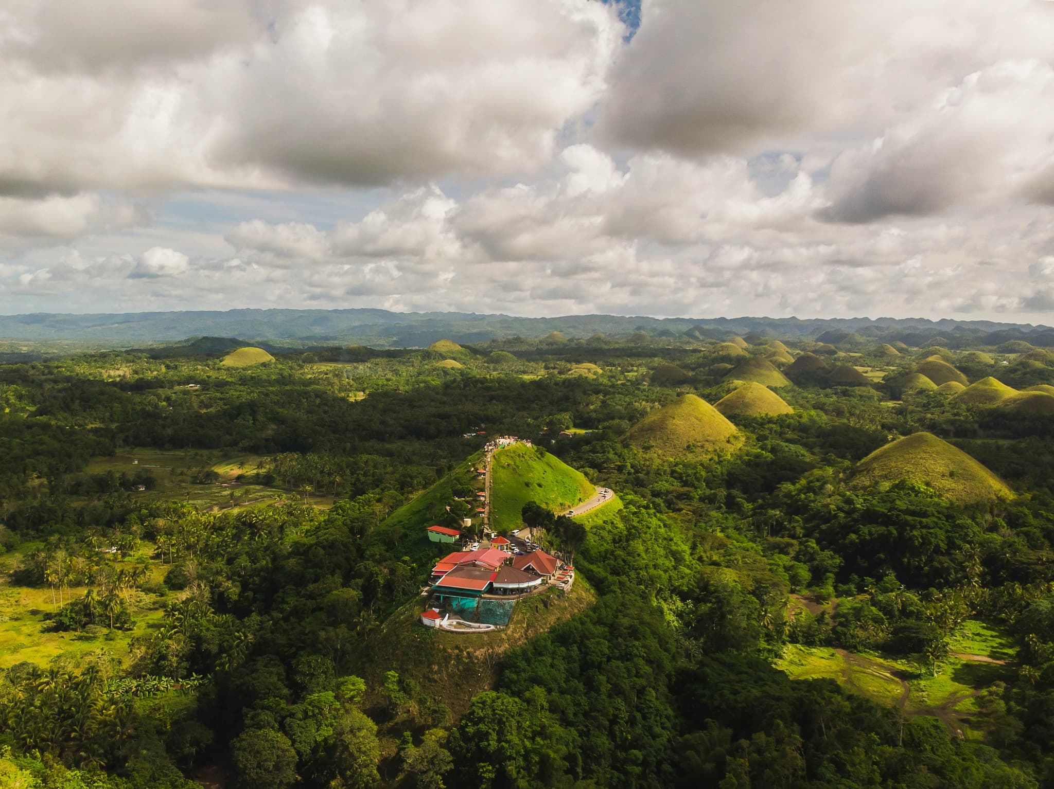 green grass Chocolate Hills Bohol Philippines from above