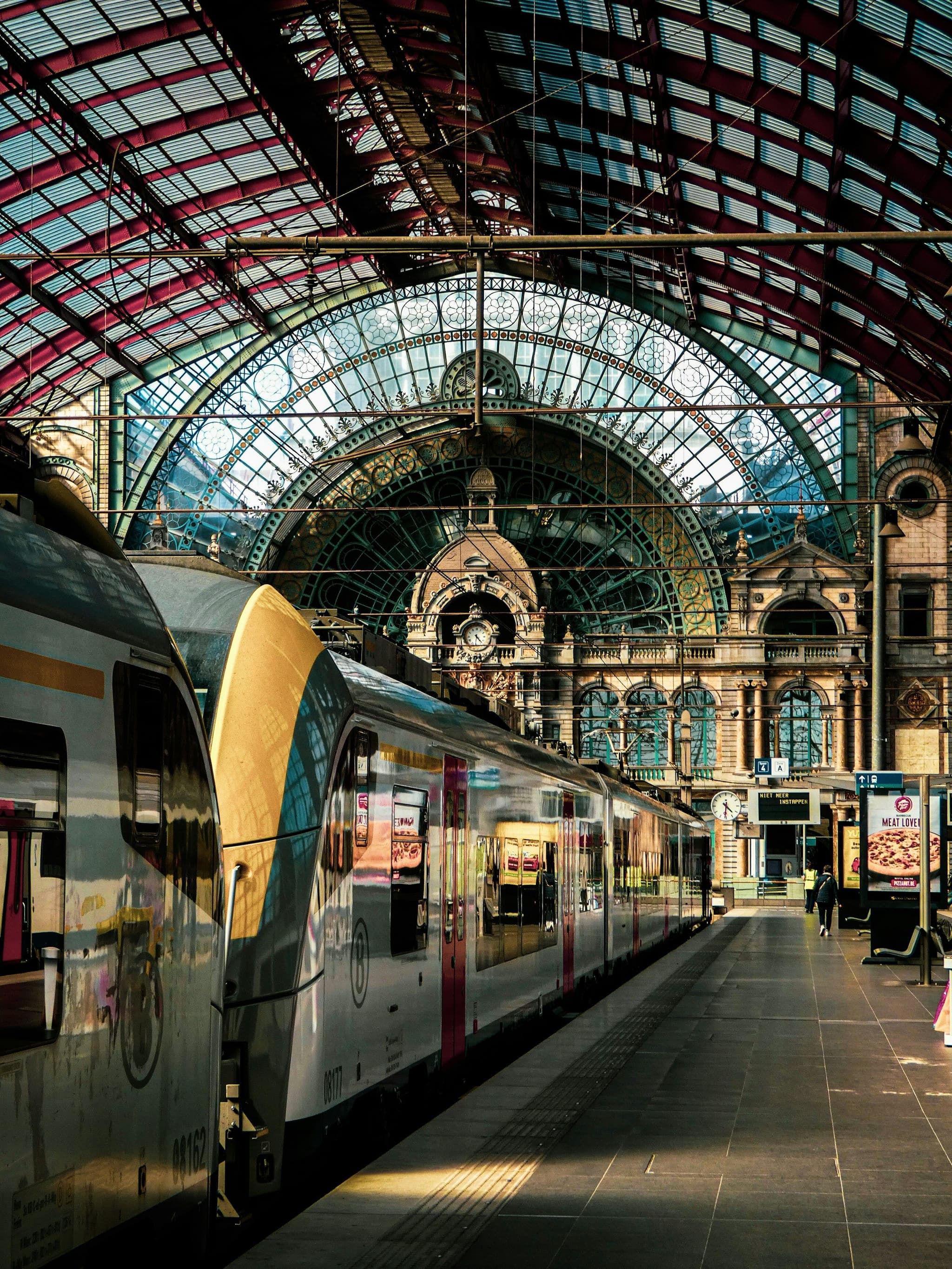 Sunlight streaming into the train hall of Antwerpen-Centraal station