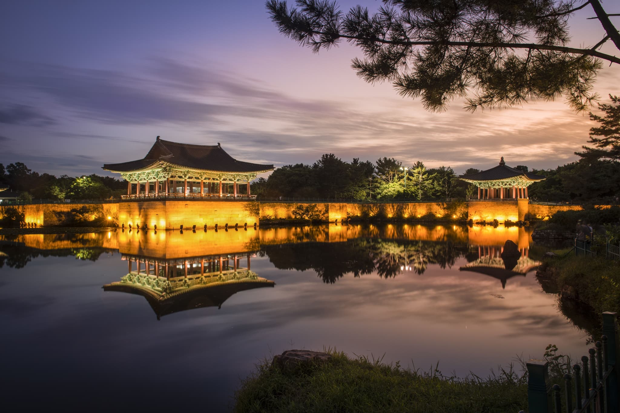 Sunset dark view of temple with lights on the water in Gyeongju