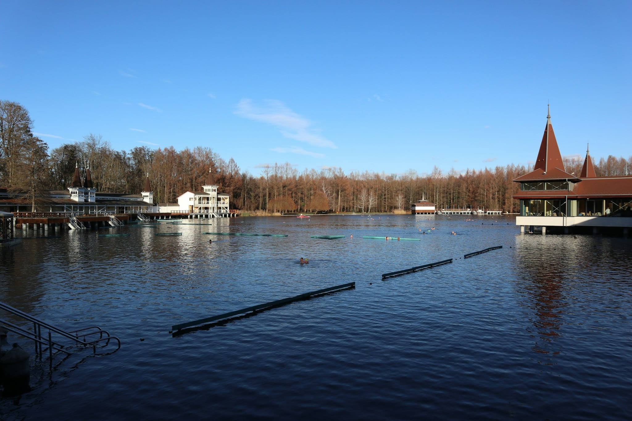 A lake with a building in the background