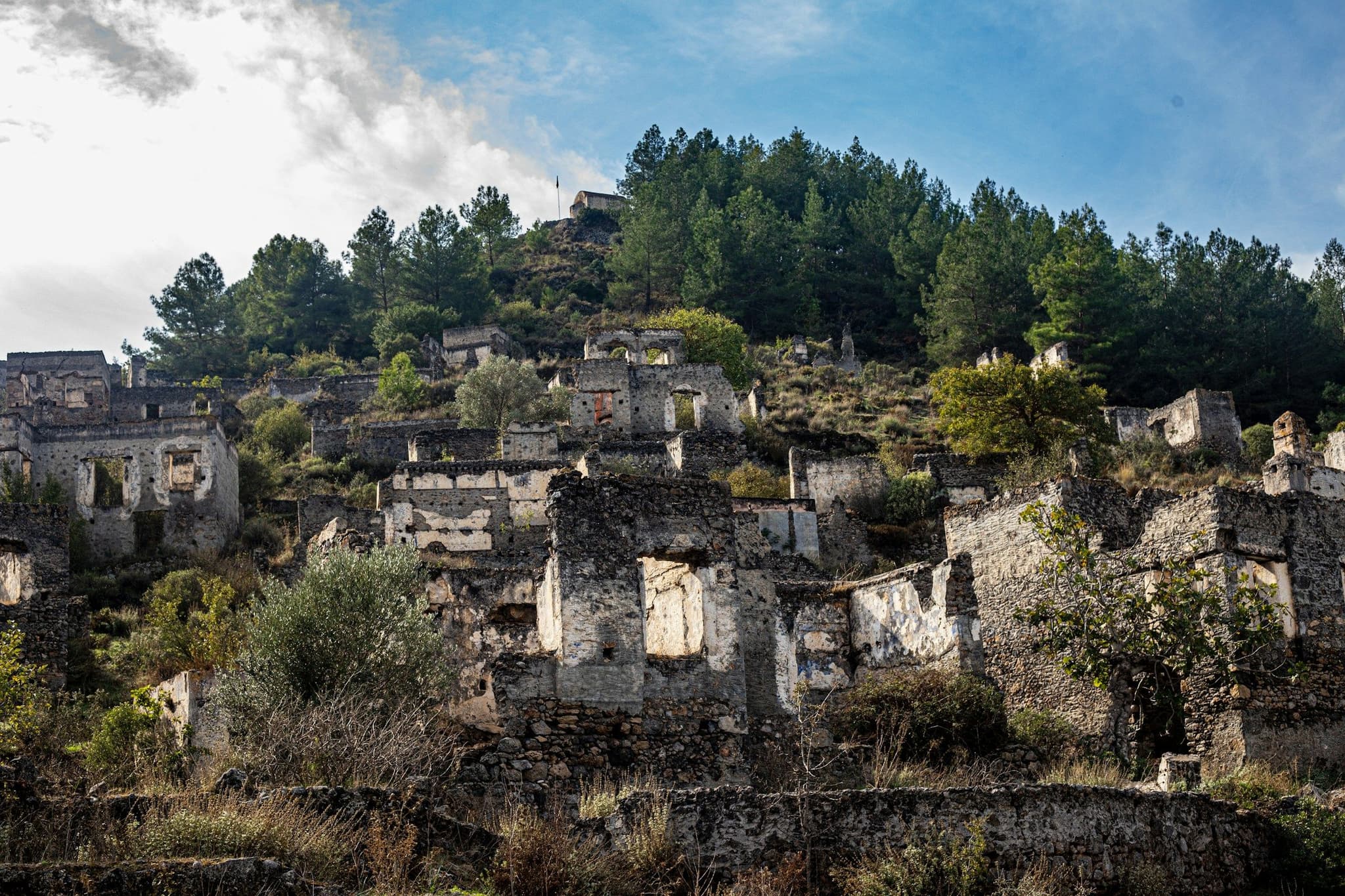 Roofless stone ruin among trees near Fethiye