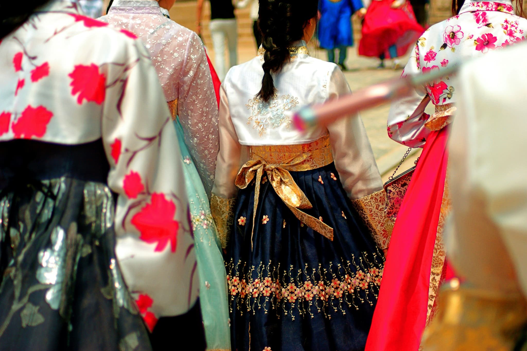 Closeup of women wearing hanbok colourful clothing at a Seoul palace