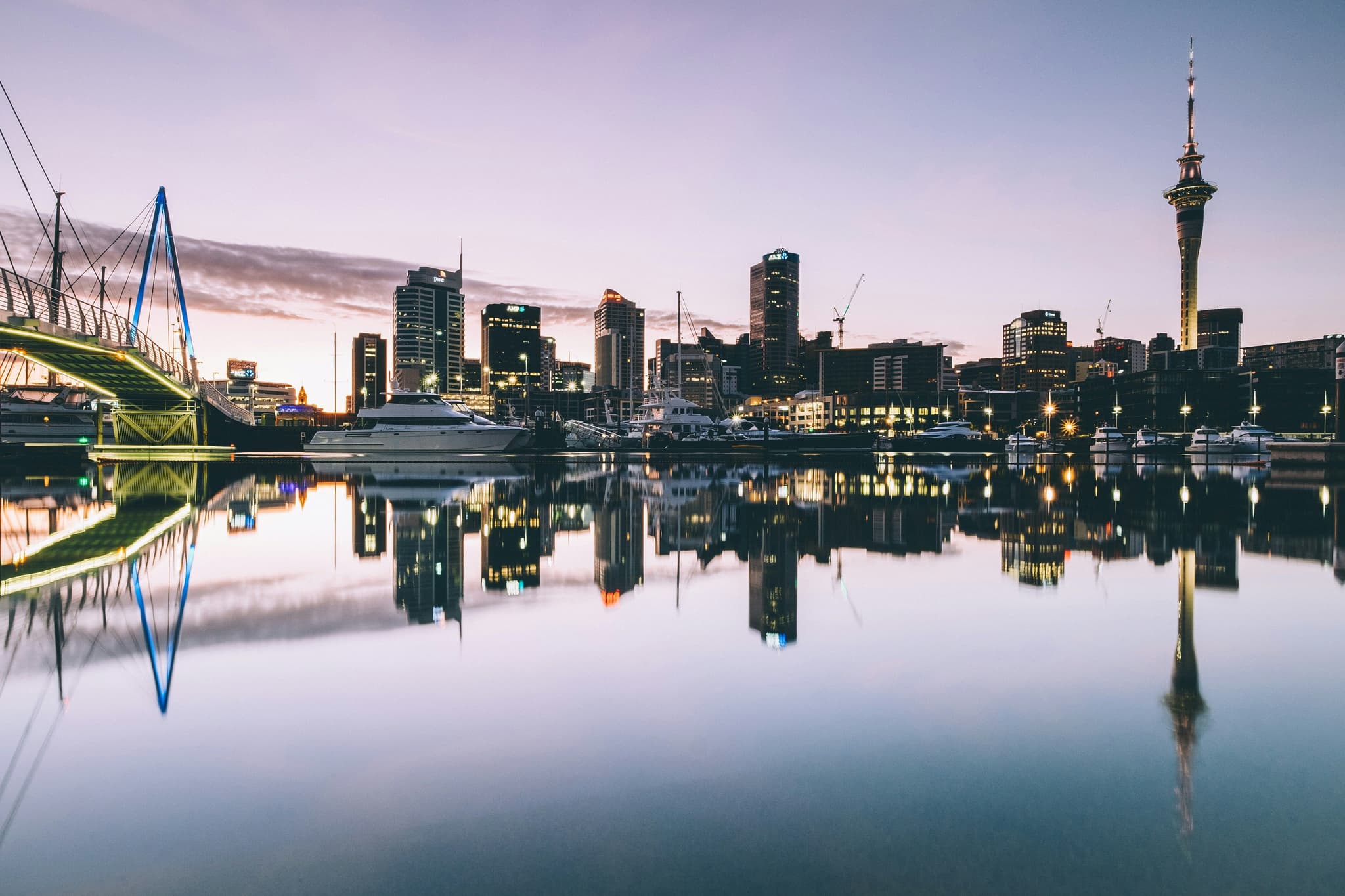 Skyline at night in new zealand reflected on the water