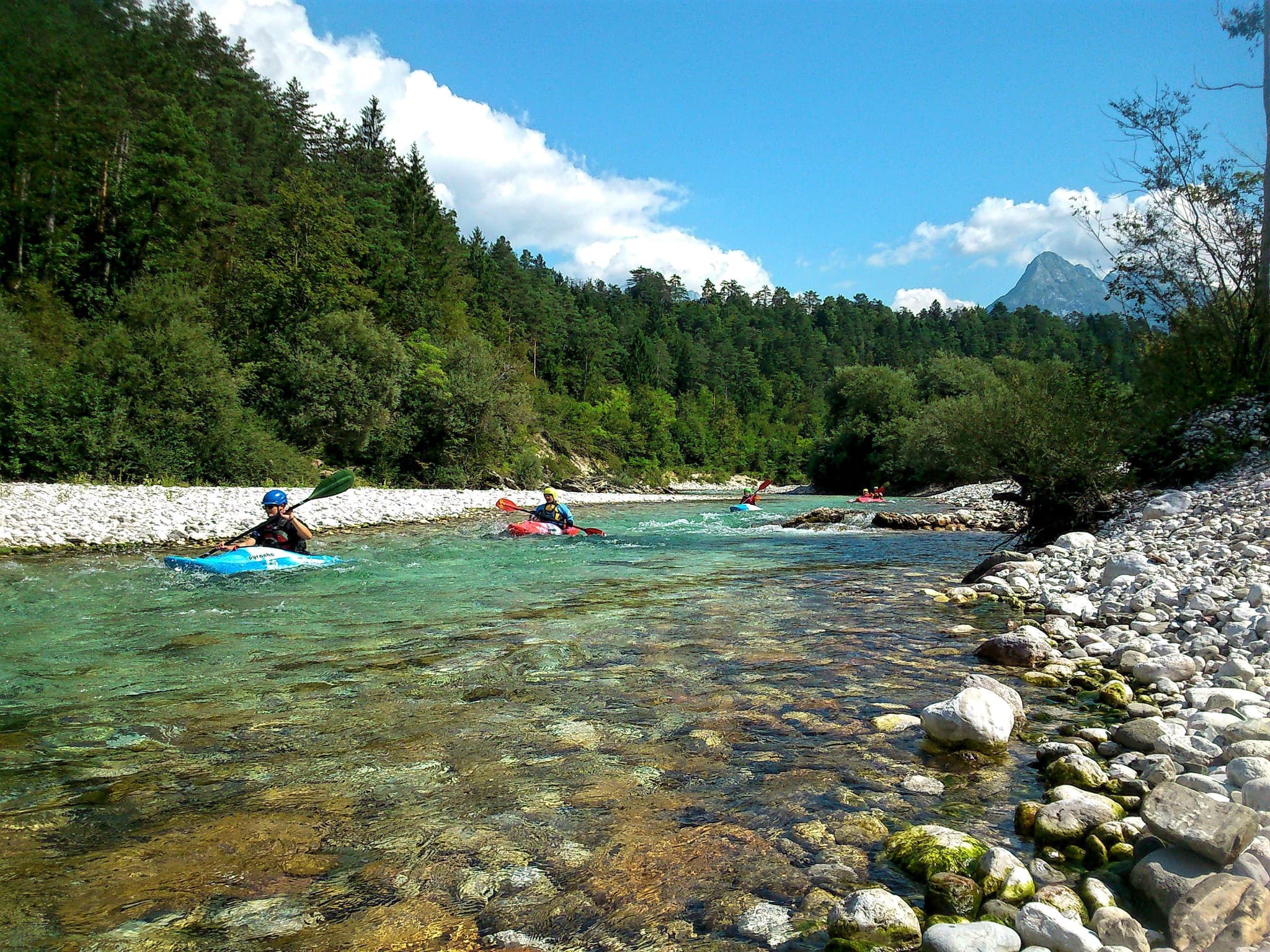Two people rafting and kayaking in the Soča Valley