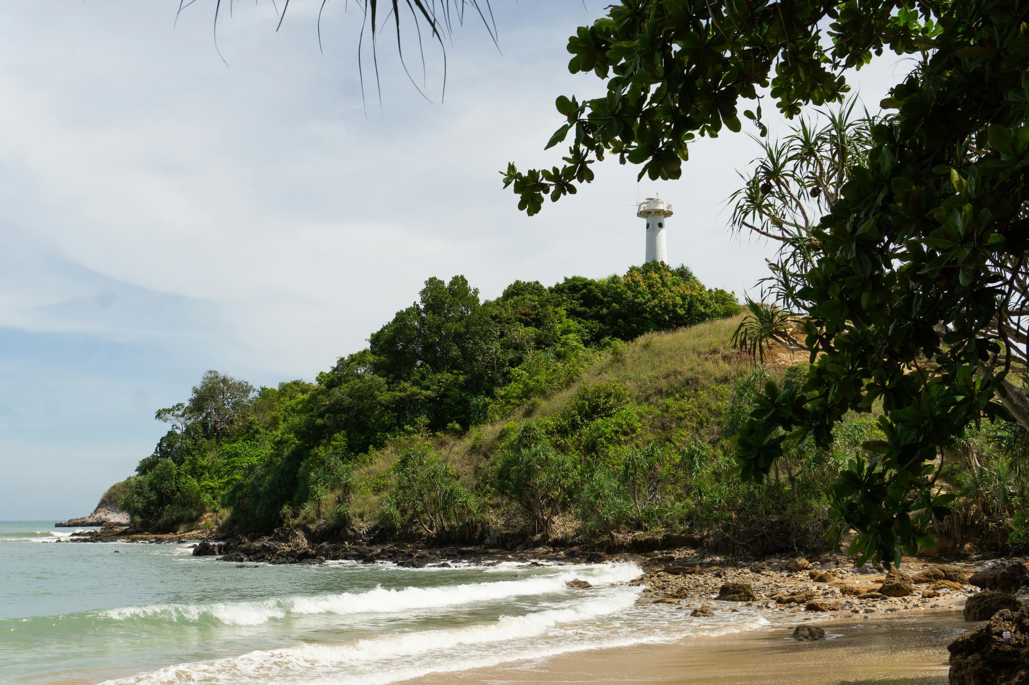 Koh lanta beach with waves and green hills