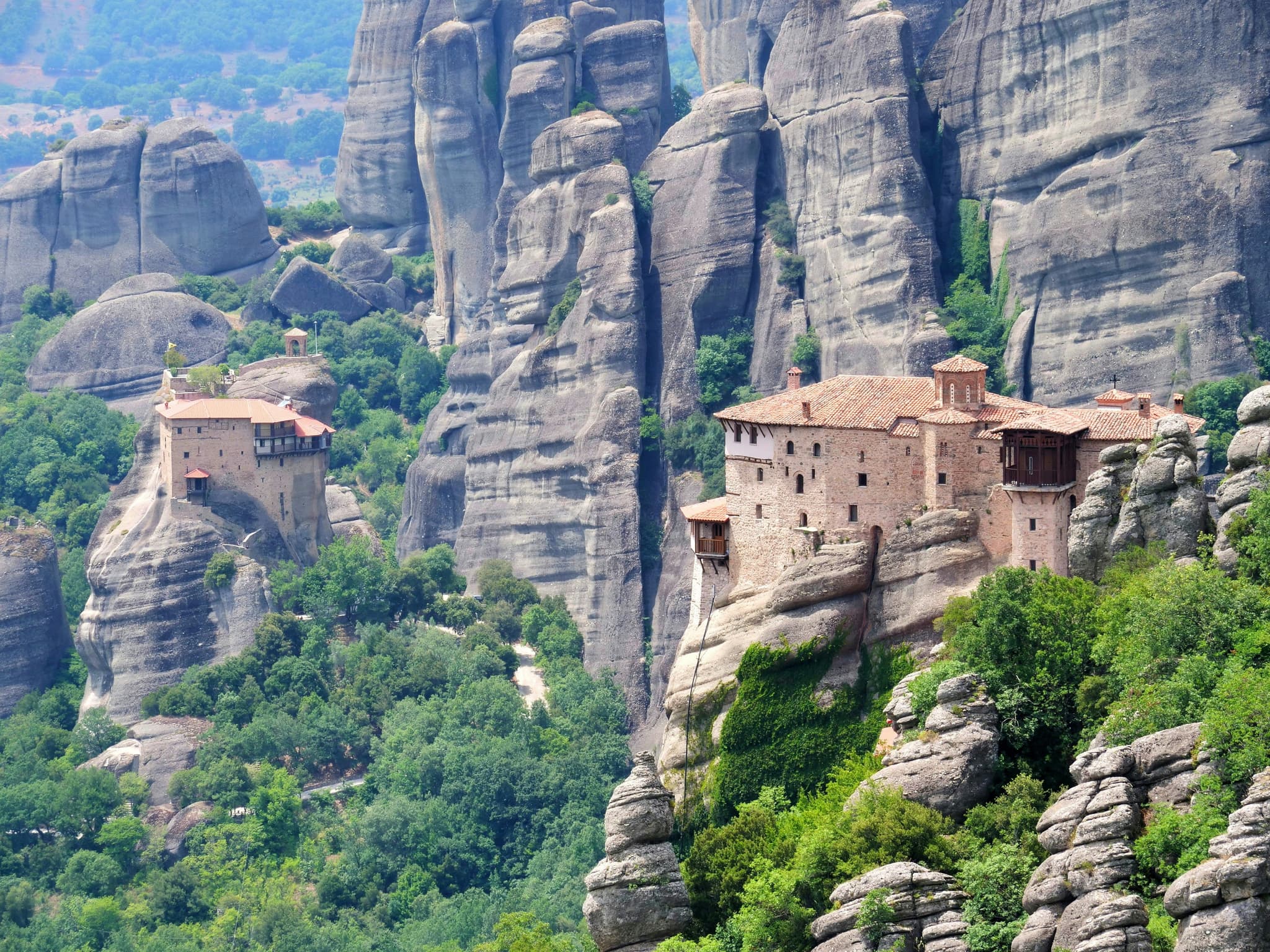 Meteora monasteries on rock pillars surrounded by trees