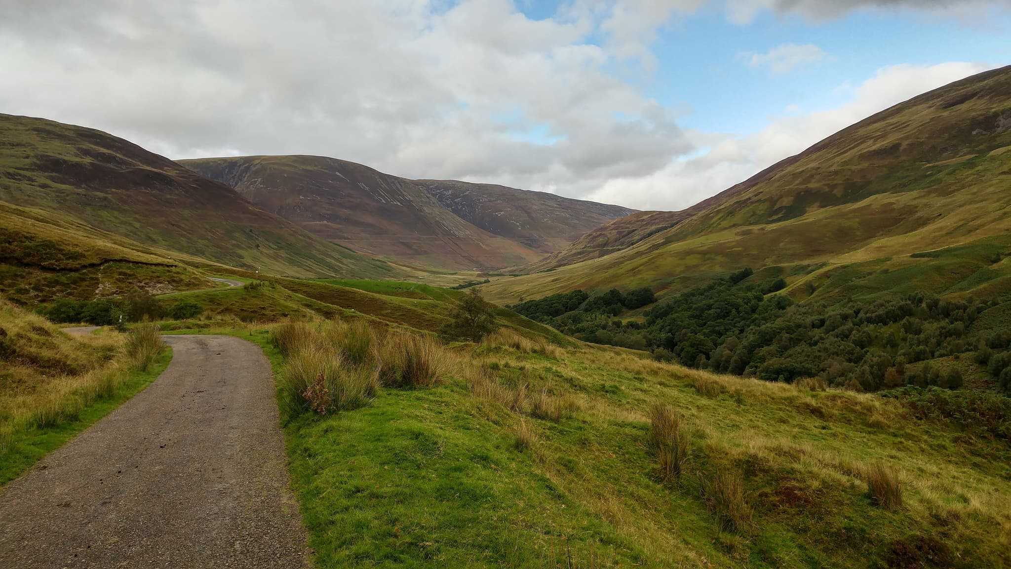 Green grass and curvy mountains in Glen of Aherlow