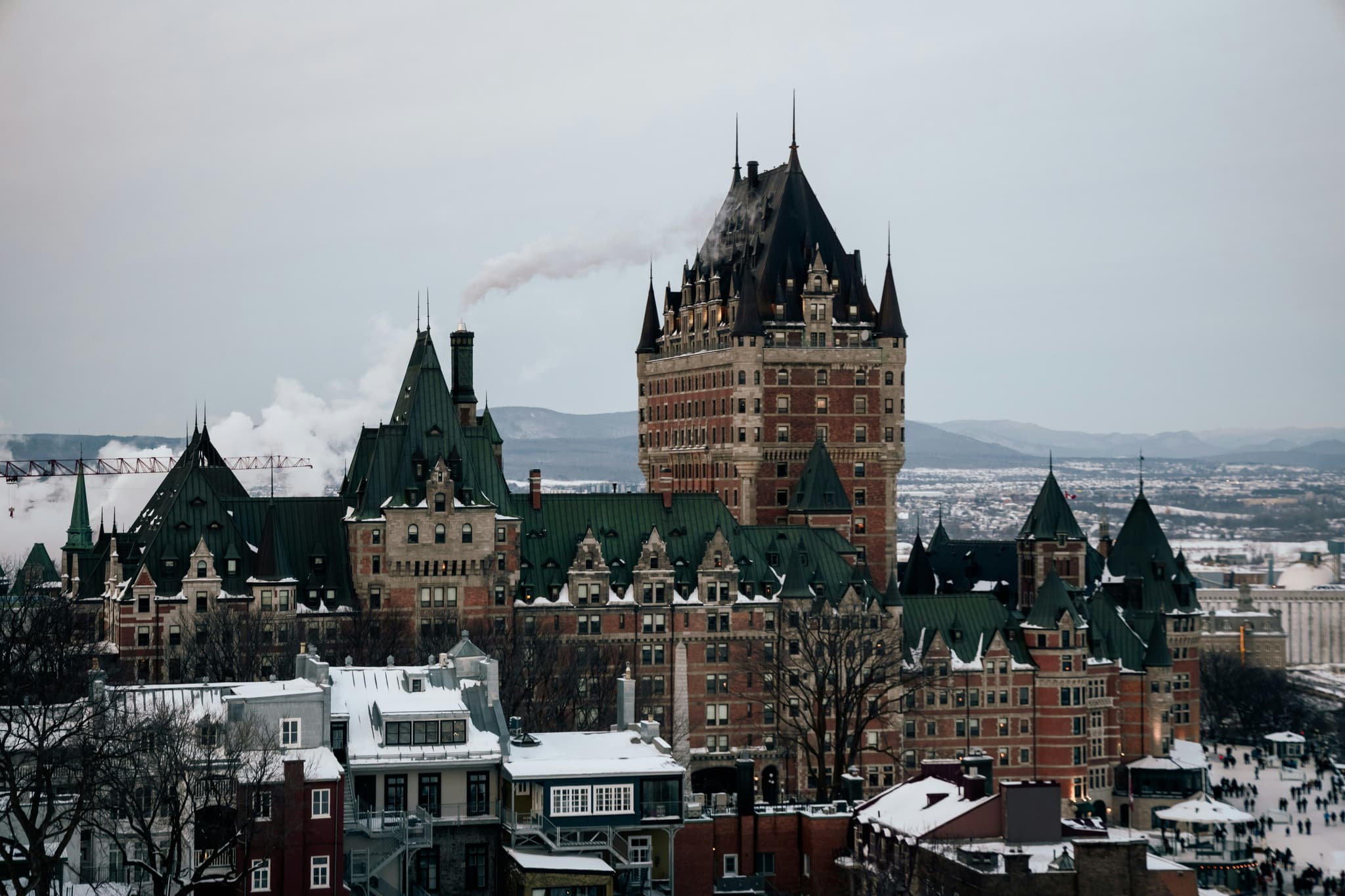 The Fairmont Château Frontenac in Quebec City, dusted with snow in winter, the landmark hotel that hosts the carnival's masked ball.