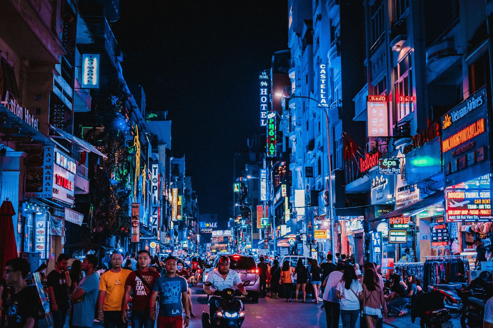 Neon lights in the city center with a lot of people in Ho Chi Minh City