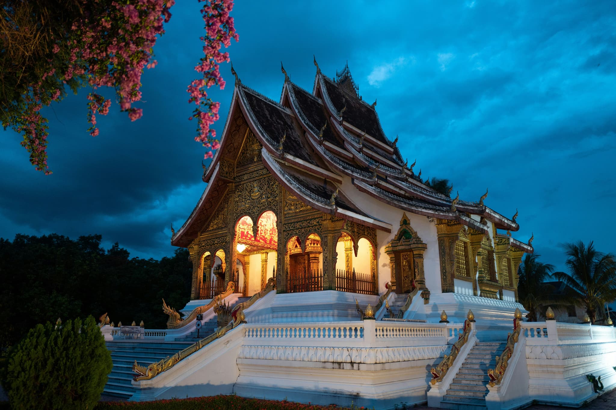 A lit temple on a dark day in Luang Prabang