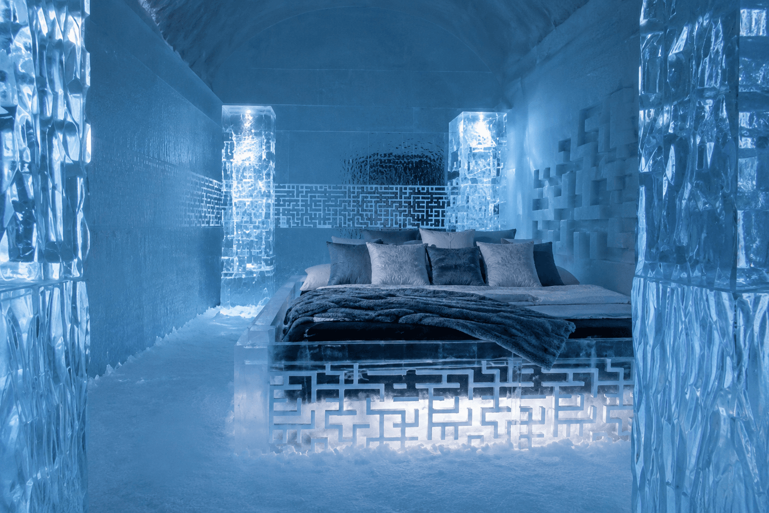 bed in a room made of ice sculpture